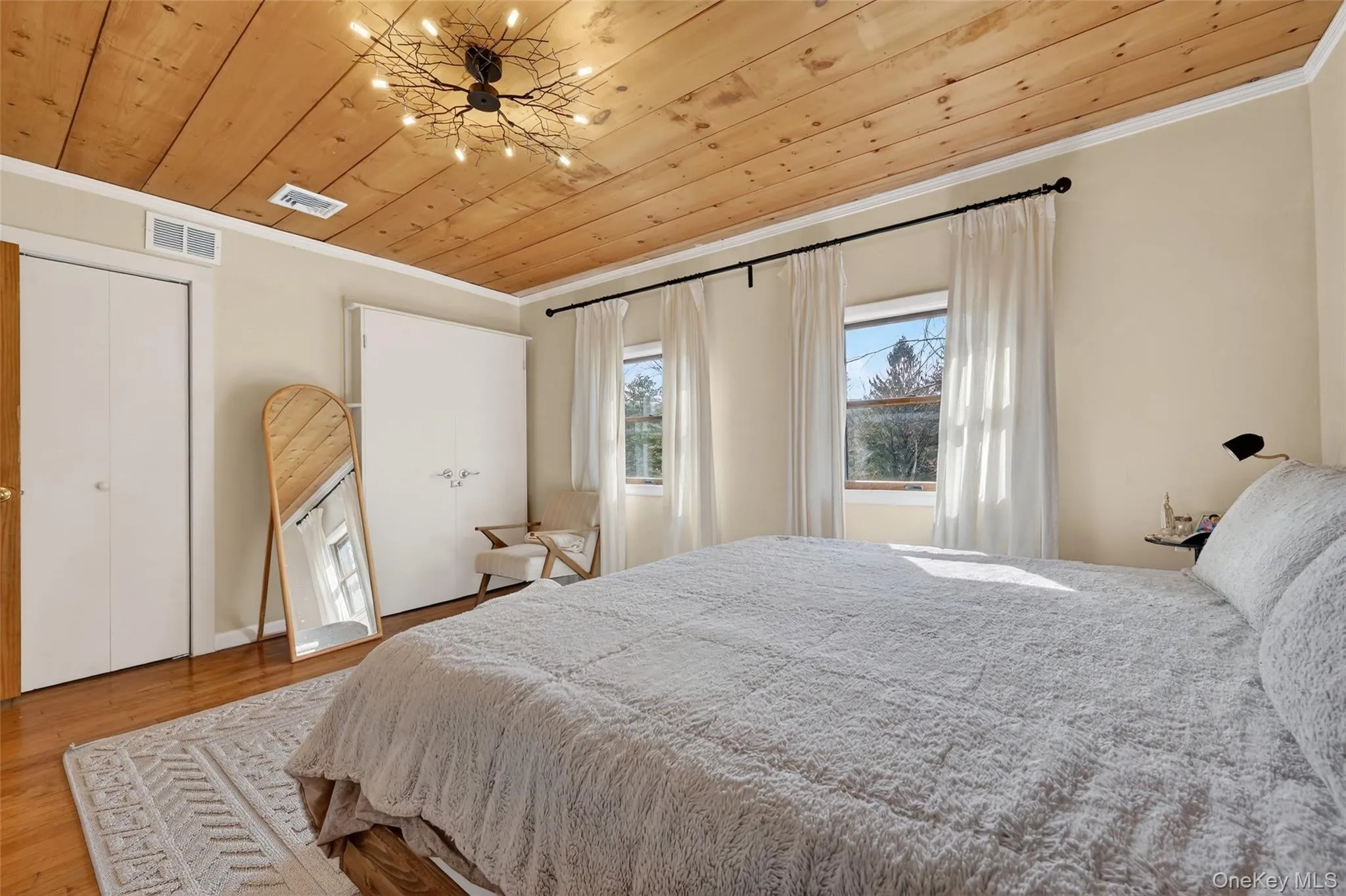 Wood-paneled ceiling with a sculptural light fixture Wood-paneled ceiling with a sculptural light fixture