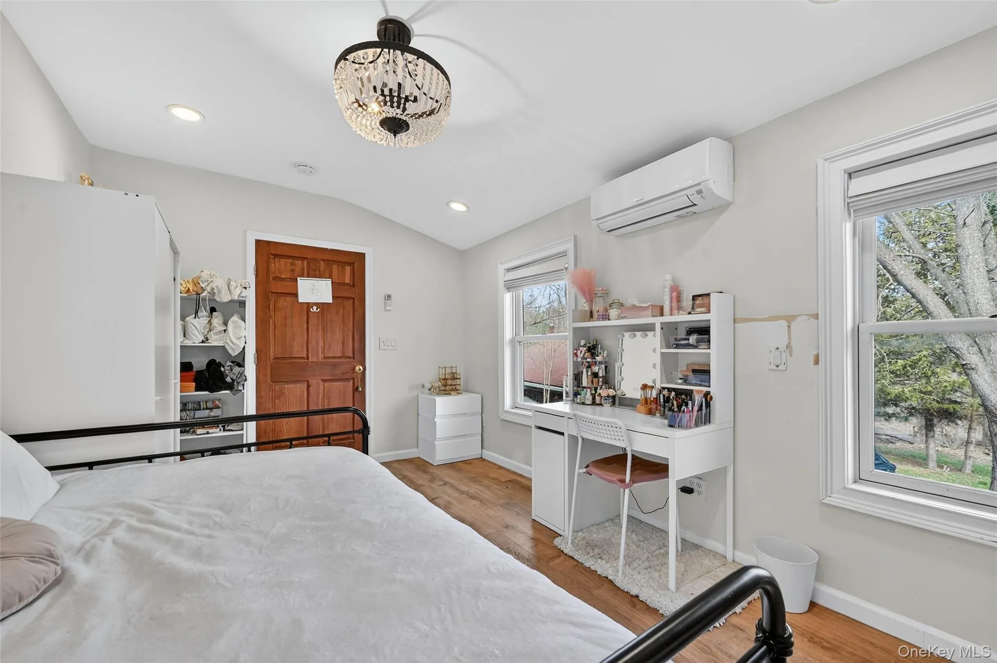 Vaulted ceilings with recessed lighting and a decorative chandelier Vaulted ceilings with recessed lighting and a decorative chandelier