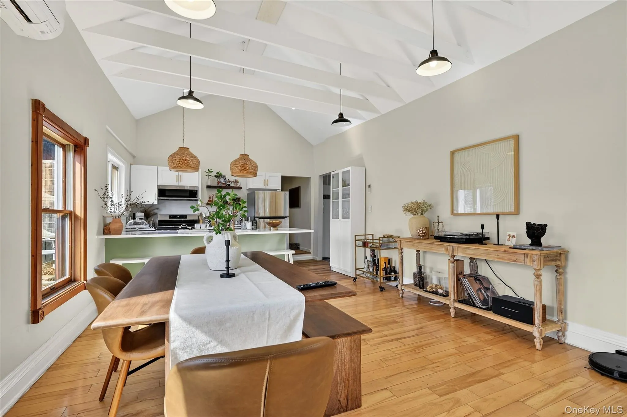 Vaulted ceiling with exposed white beams and pendant lighting Vaulted ceiling with exposed white beams and pendant lighting