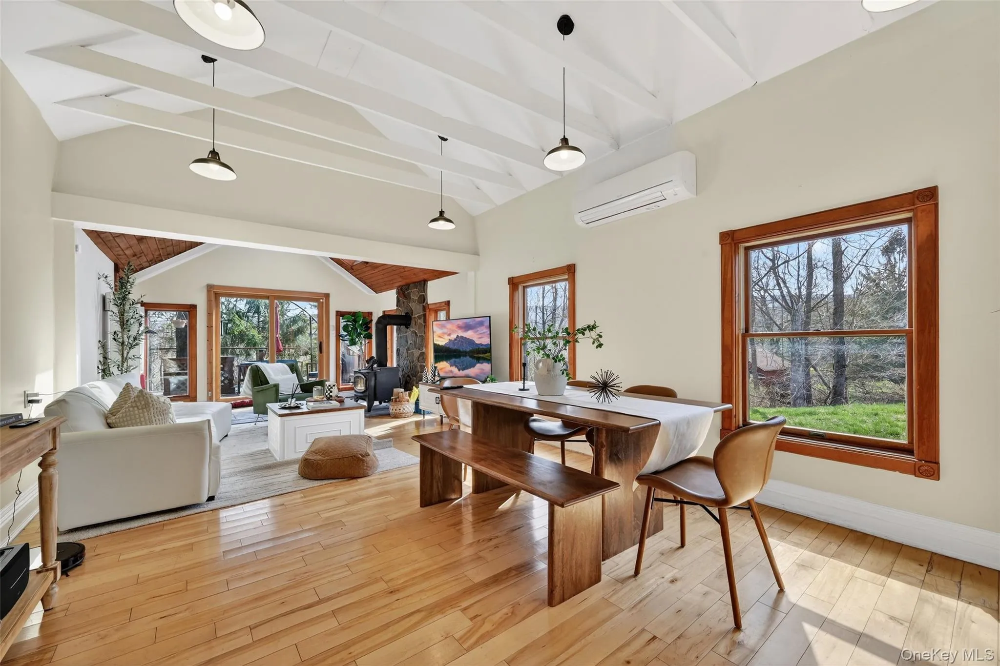Vaulted ceilings with exposed white beams and pendant lighting Vaulted ceilings with exposed white beams and pendant lighting