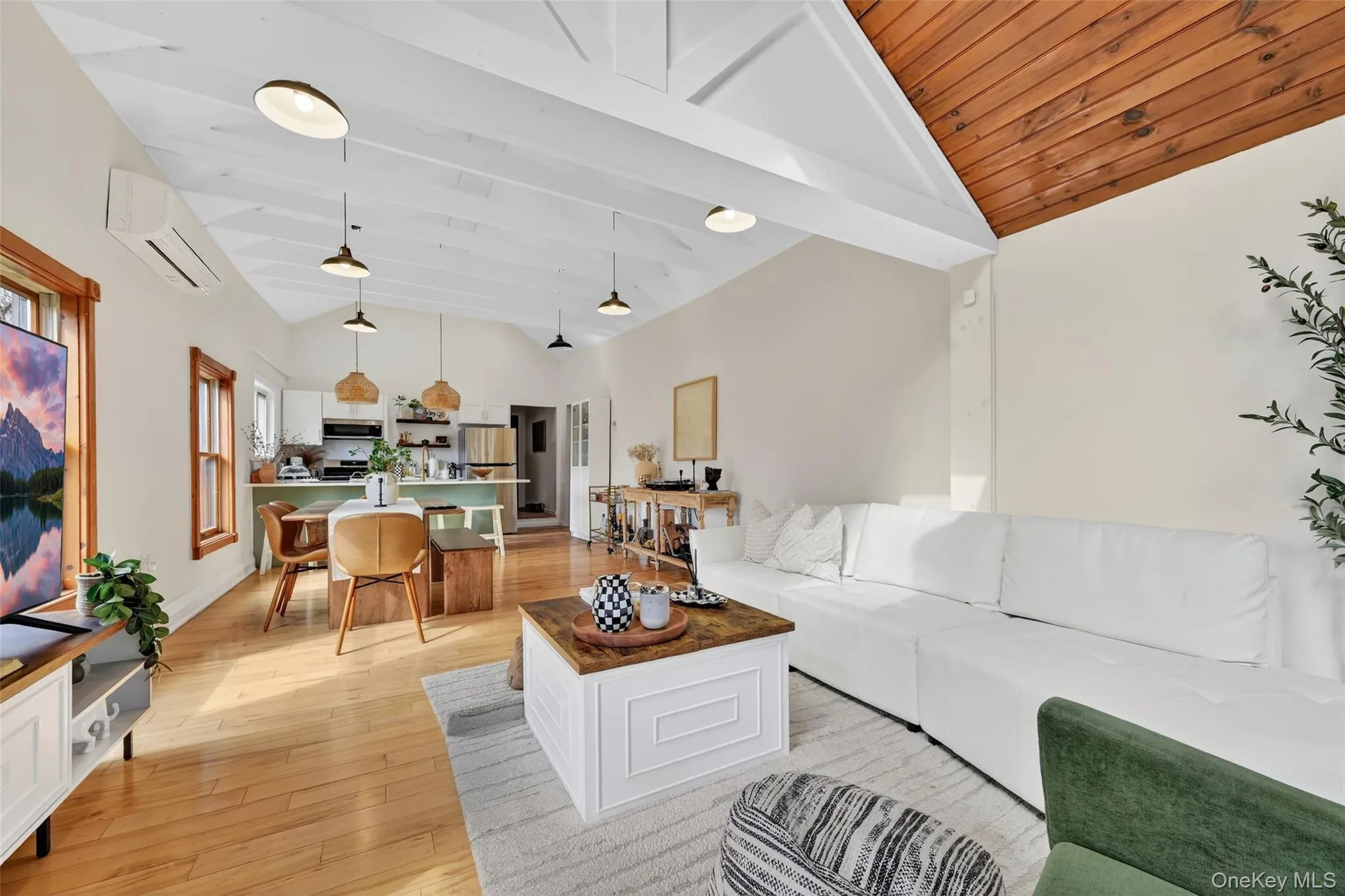 Vaulted wood plank ceilings with exposed white beams and recessed lighting Vaulted wood plank ceilings with exposed white beams and recessed lighting