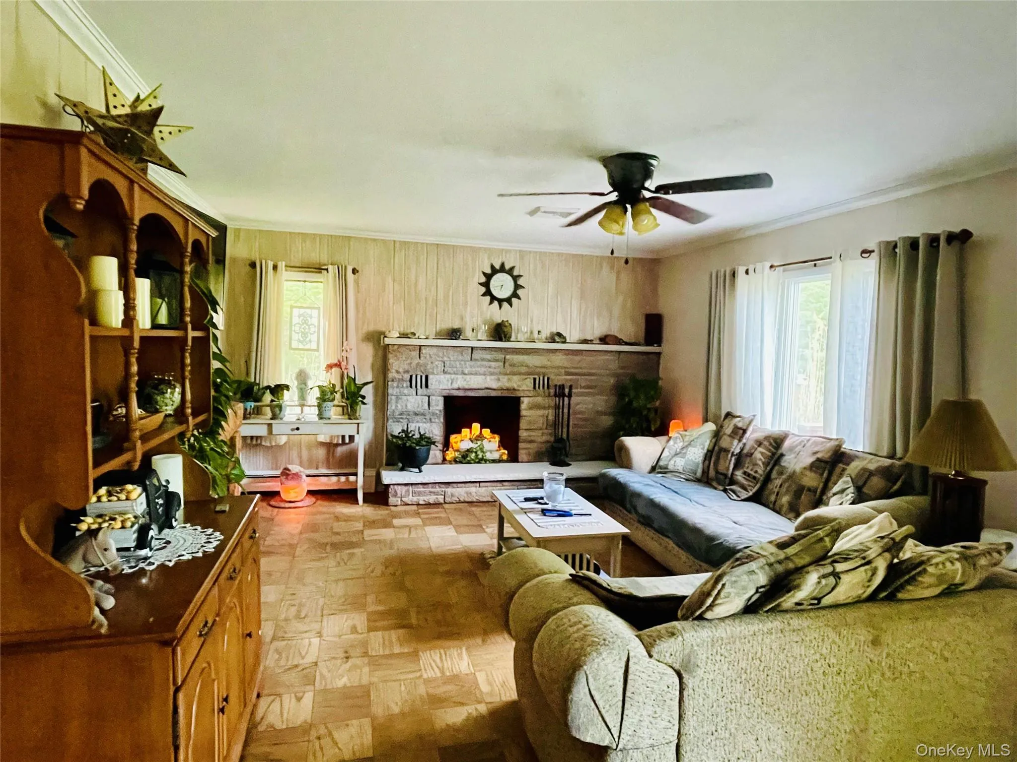 Open concept Living Room with parquet tile flooring, fireplace. Open concept Living Room with parquet tile flooring, fireplace.