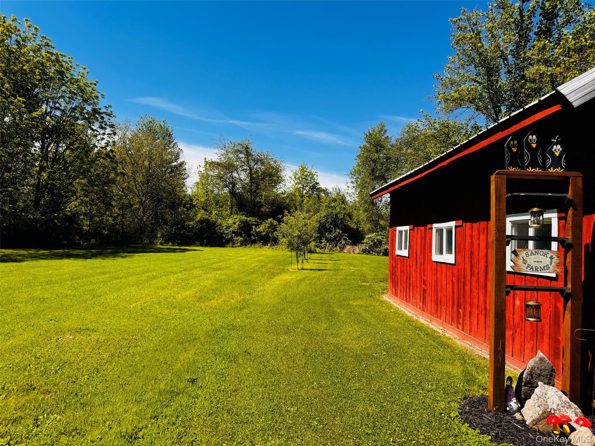 Barn showing expansive back yard and fruit trees. Barn showing expansive back yard and fruit trees.