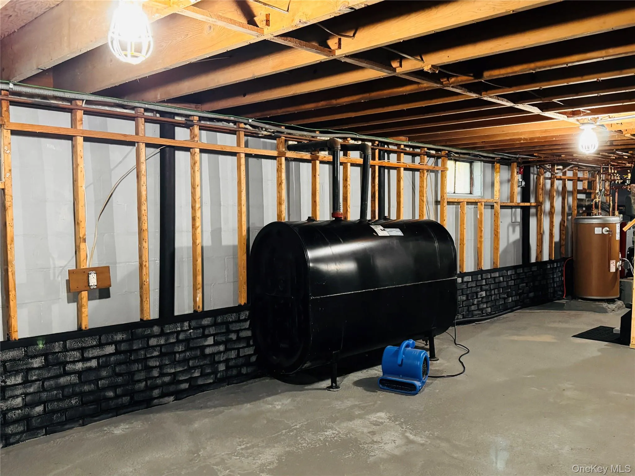Basement with 300 gallon oil tank. Basement with 300 gallon oil tank.