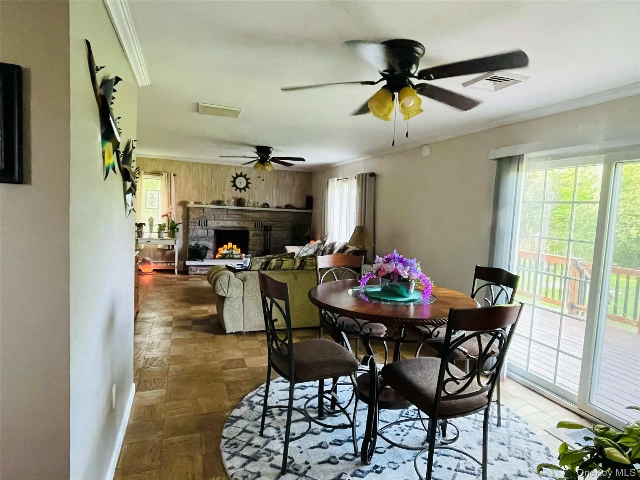 Open concept Dining room with sliding glass doors that lead to the back deck and yard. Open concept Dining room with sliding glass doors that lead to the back deck and yard.