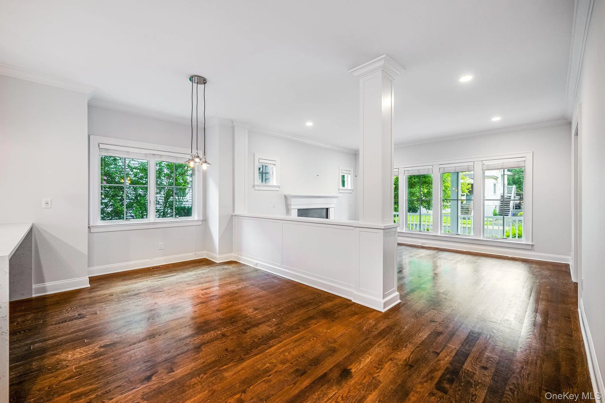 Dining Area with Half Wall Overlooking Living Room Dining Area with Half Wall Overlooking Living Room