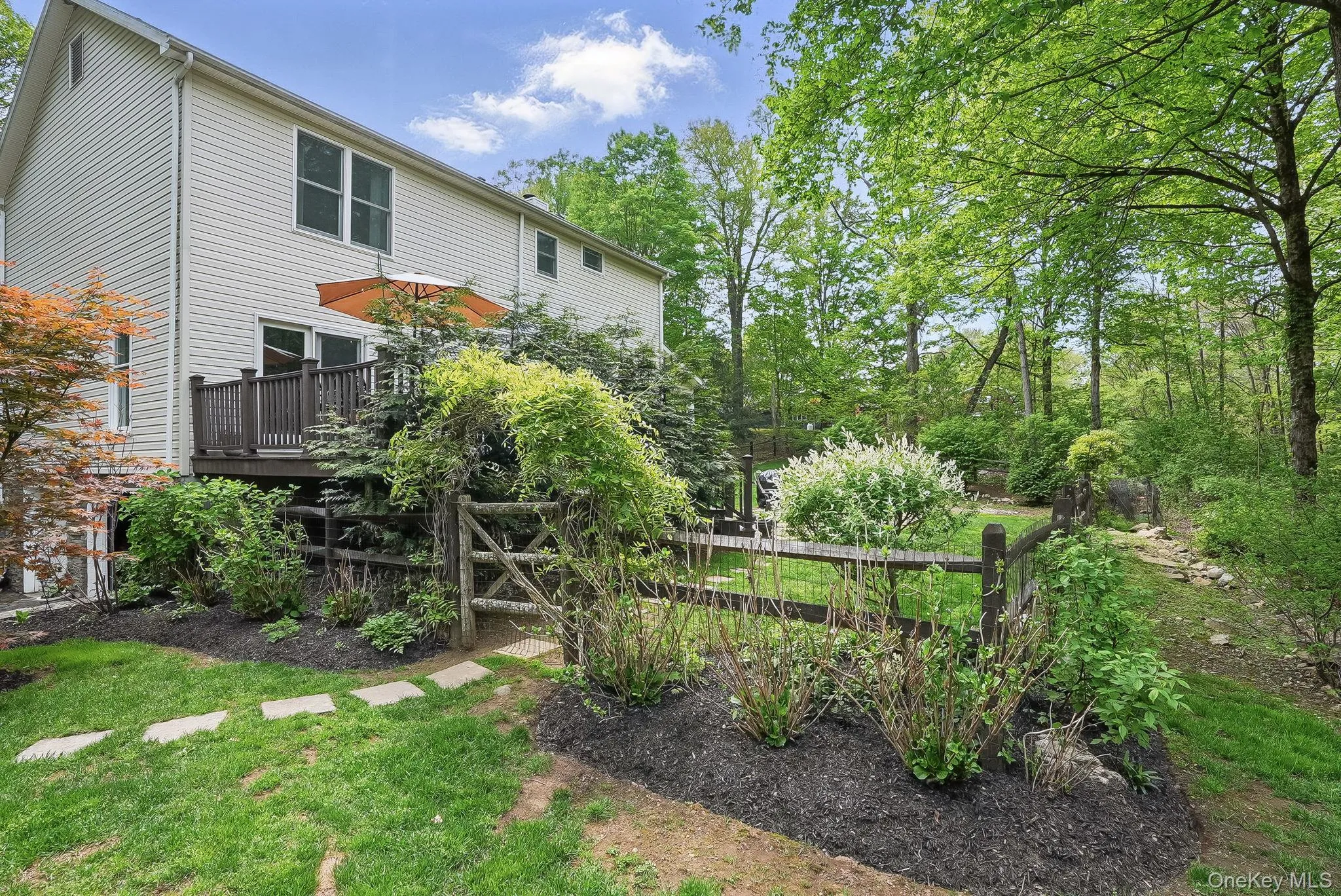 View of yard with a wooden deck View of yard with a wooden deck