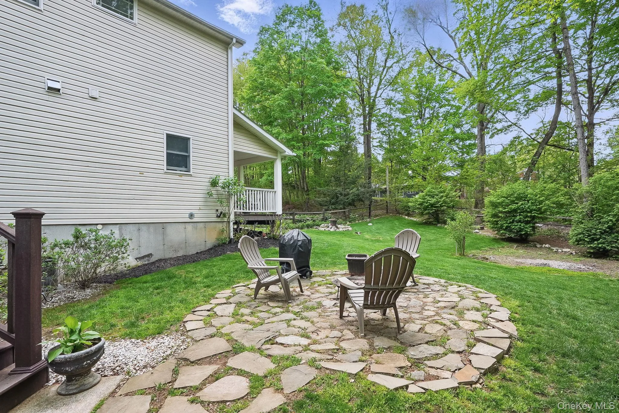 View of yard featuring a patio area and a fire pit View of yard featuring a patio area and a fire pit