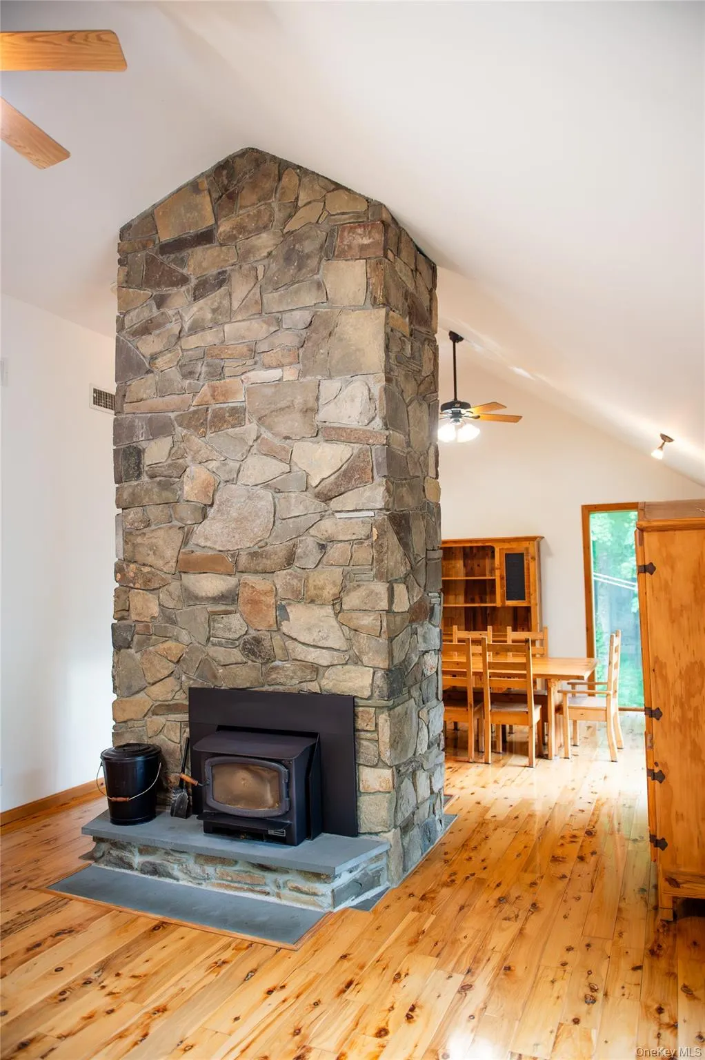 Double sided stone fireplace-Living room view Double sided stone fireplace-Living room view