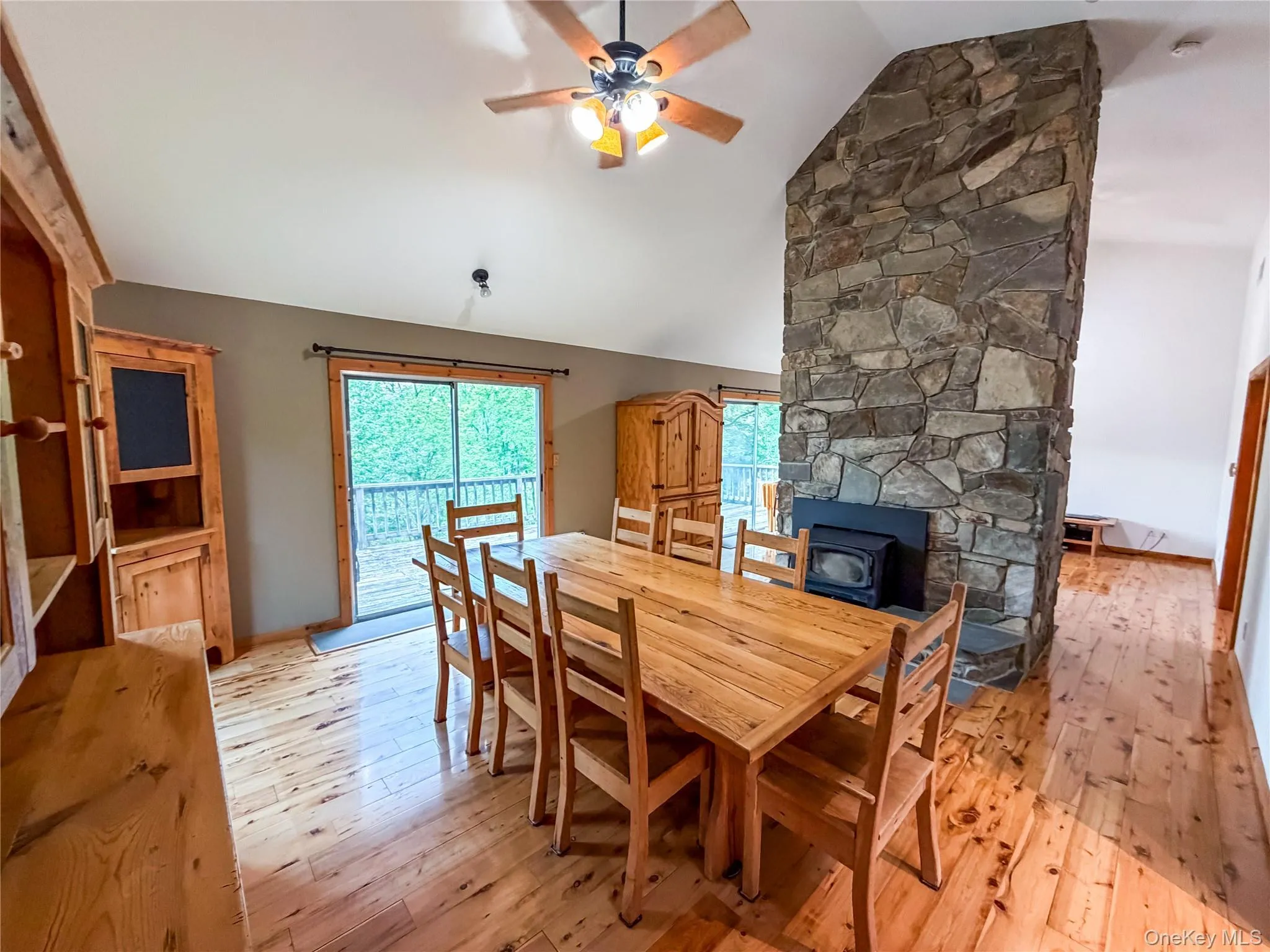 Double sided fireplace-Dining room view, SGD to deck Double sided fireplace-Dining room view, SGD to deck