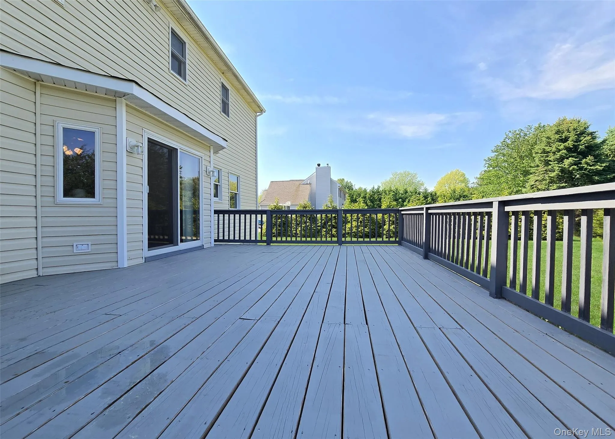 Back of home with Deck with 14x21 deck Back of home with Deck with 14x21 deck