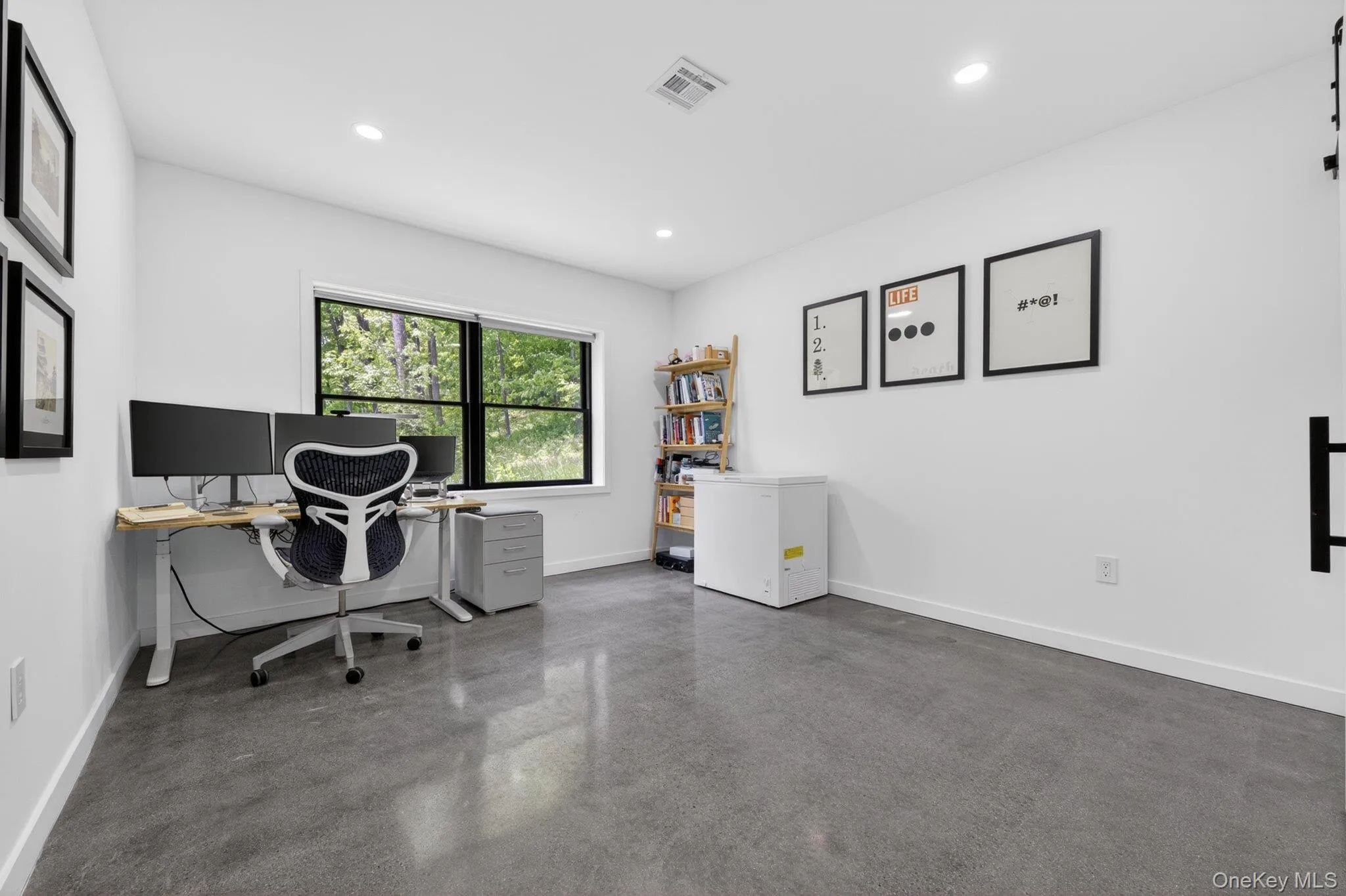 Spacious office featuring polished concrete flooring Spacious office featuring polished concrete flooring