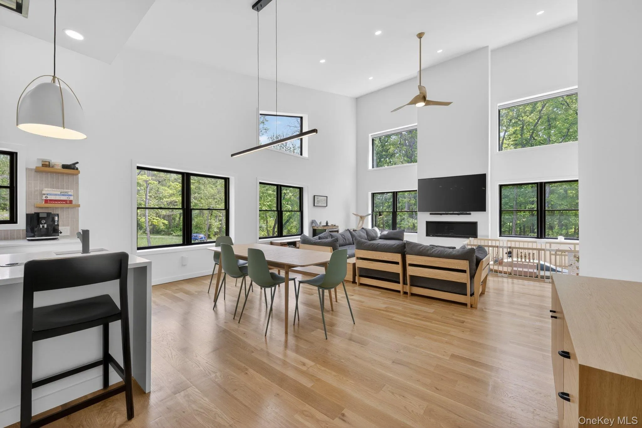 Spacious open-concept living area featuring high vaulted ceilings Spacious open-concept living area featuring high vaulted ceilings