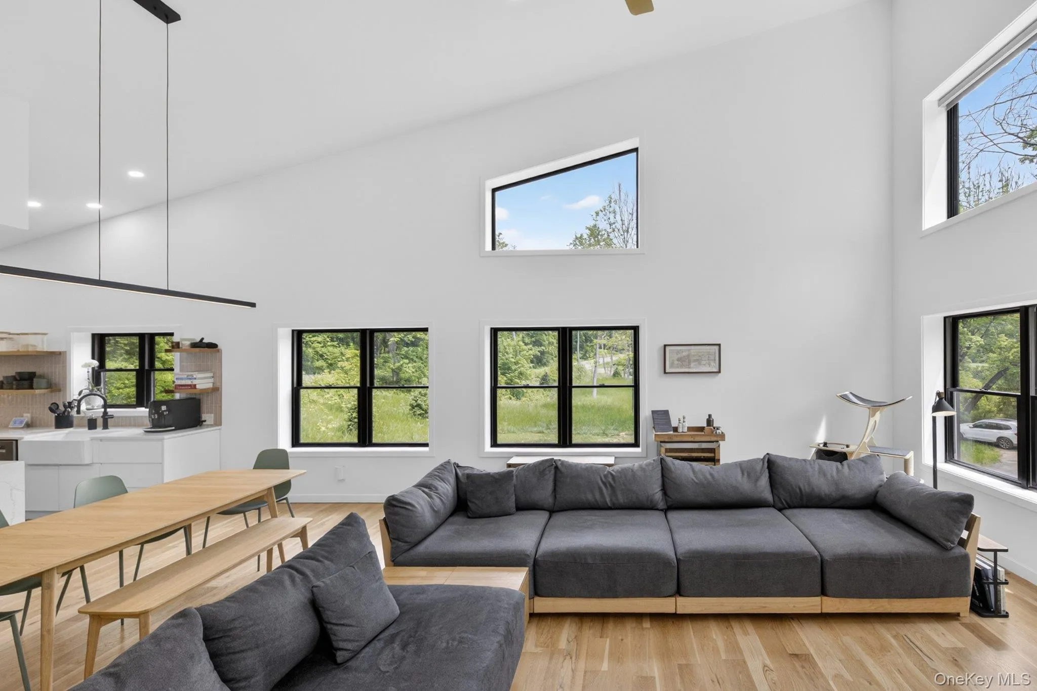 Vaulted ceilings enhance this open-concept living area with abundant natural light Vaulted ceilings enhance this open-concept living area with abundant natural light