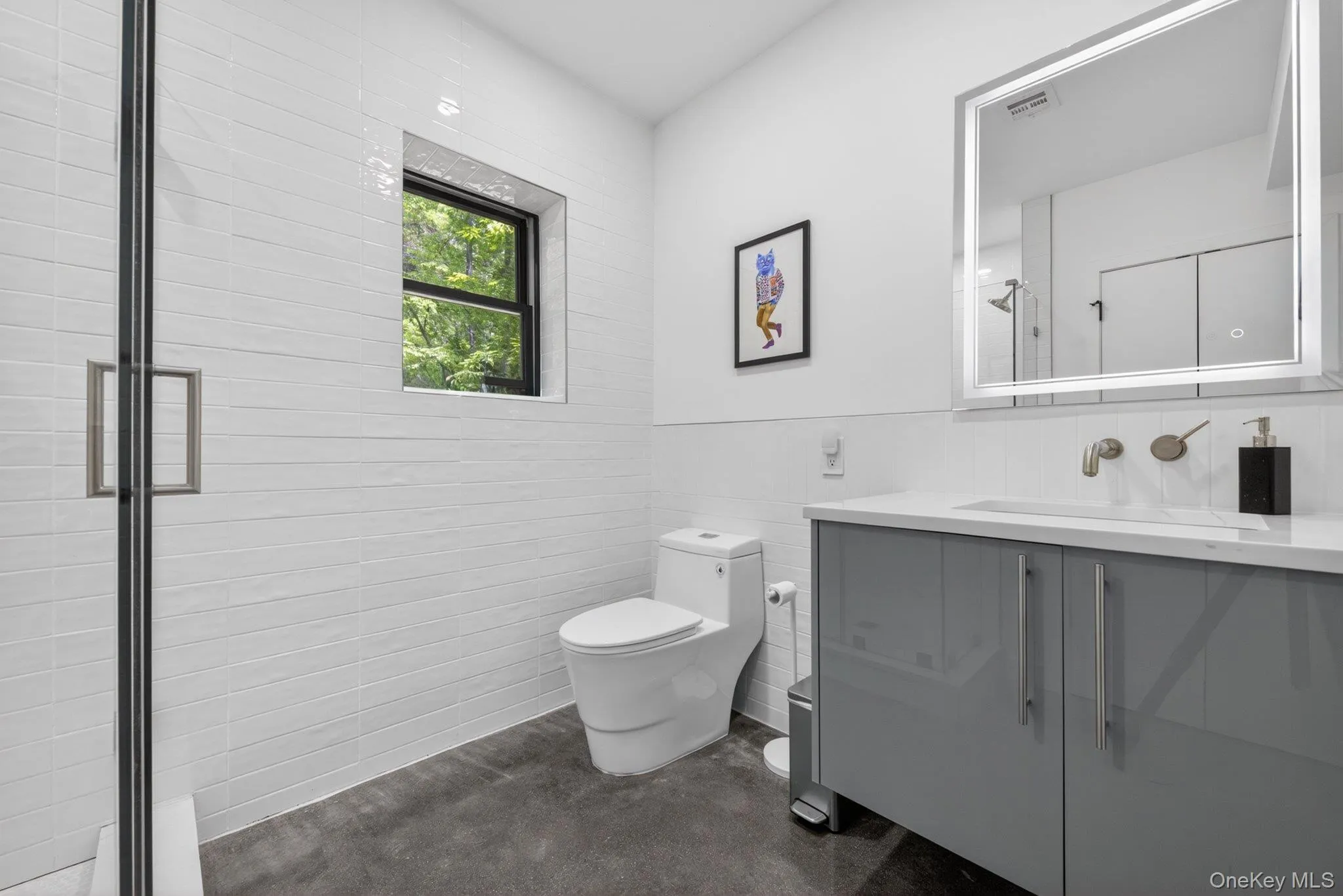 First floor bathroom featuring a glass-enclosed shower First floor bathroom featuring a glass-enclosed shower