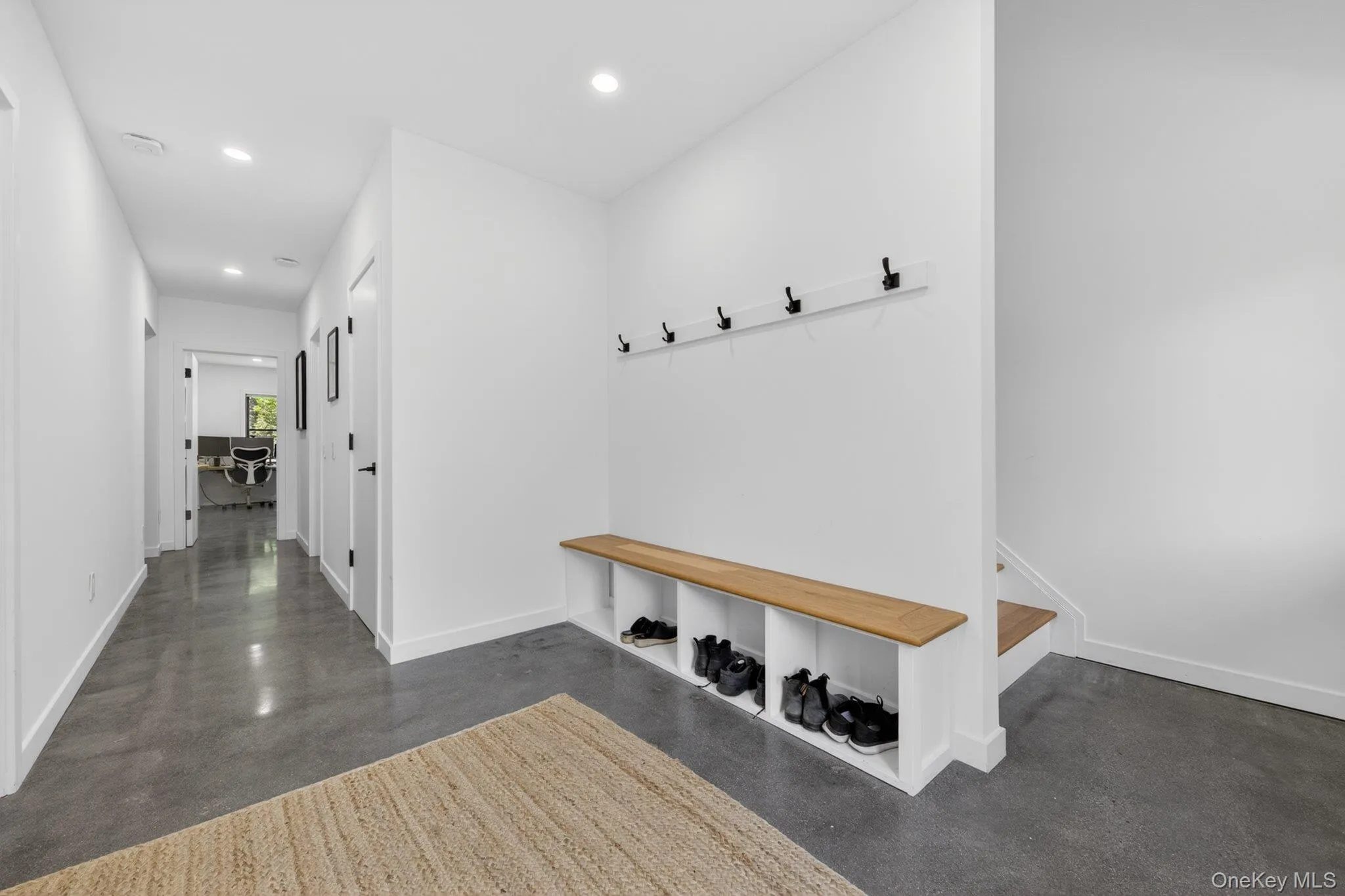 Entryway featuring a built-in bench with storage cubbies Entryway featuring a built-in bench with storage cubbies