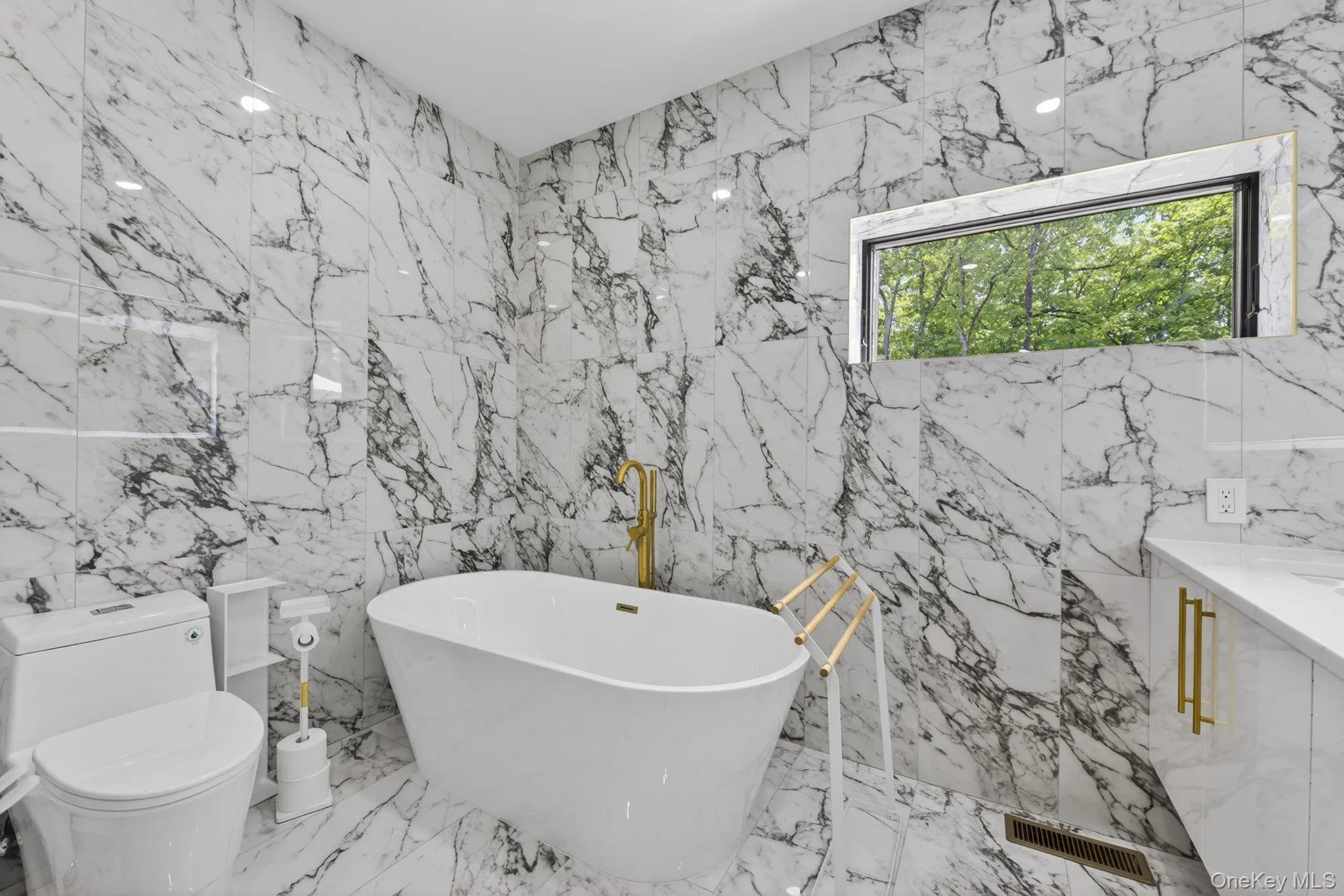 Deep soak tub and marble surround Deep soak tub and marble surround