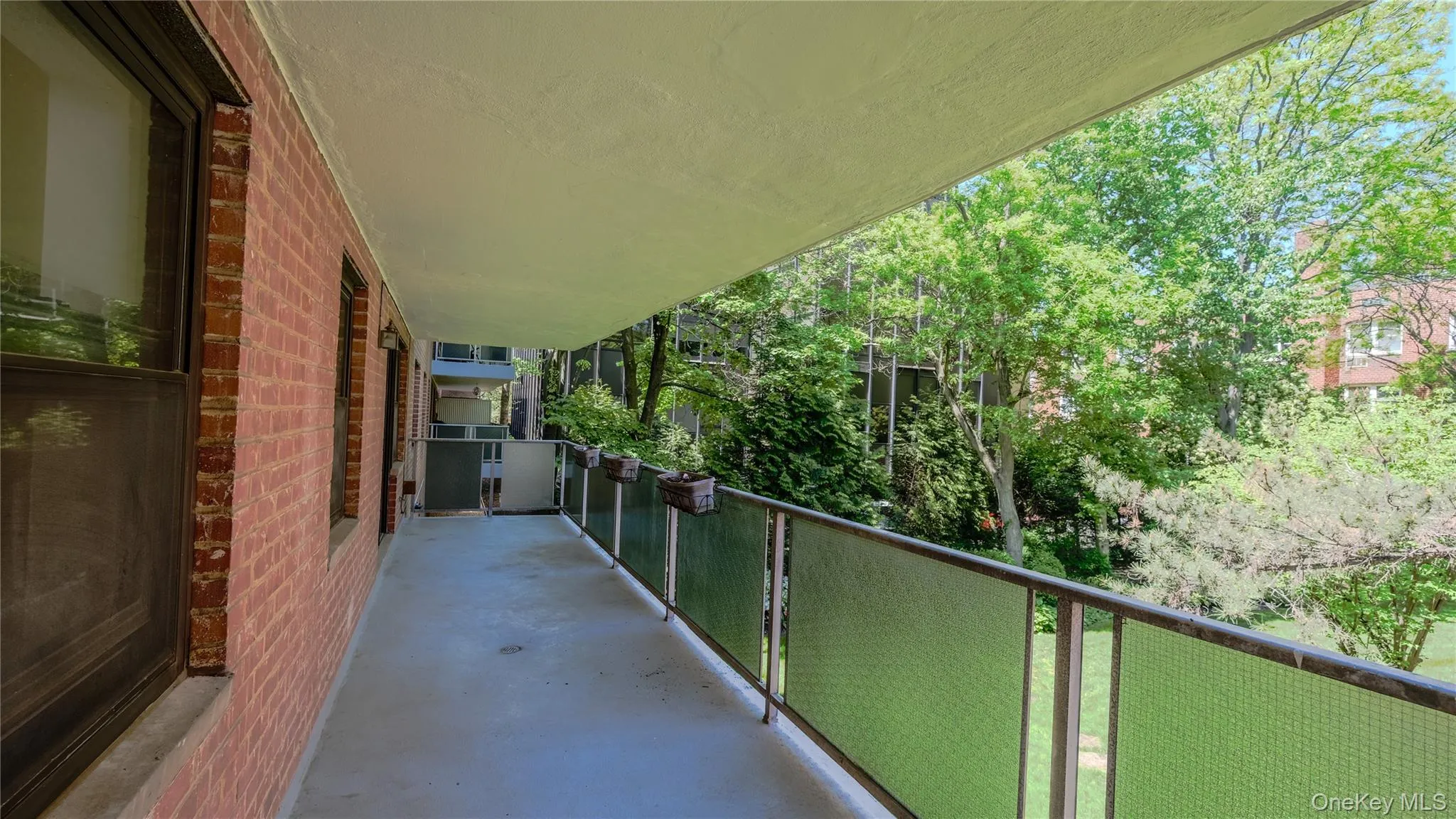 Large Covered Patio Overlooking Grassy Courtyard Large Covered Patio Overlooking Grassy Courtyard