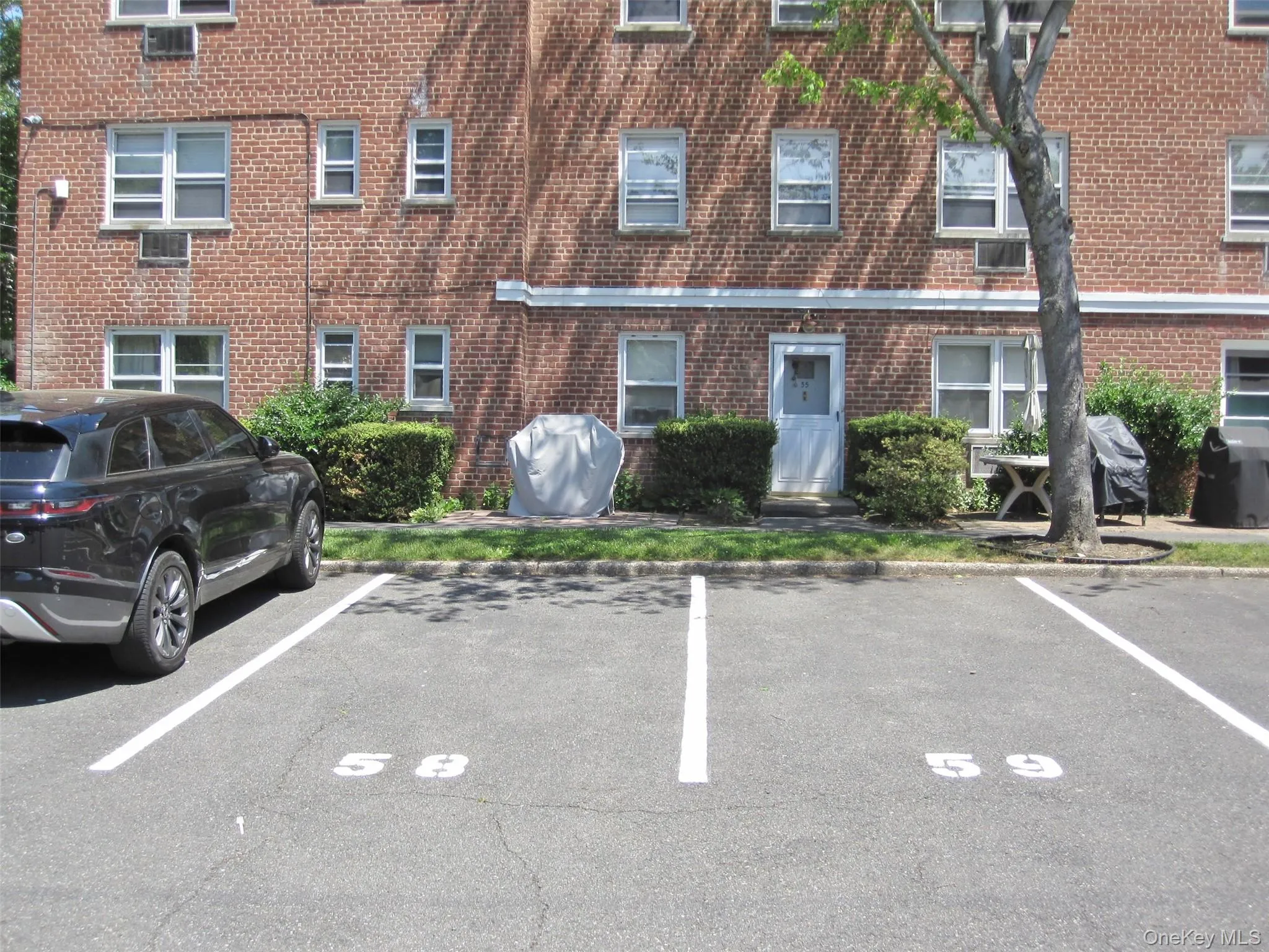 Front of home with 2 assigned parking spaces # 58 & 59. Front of home with 2 assigned parking spaces # 58 & 59.