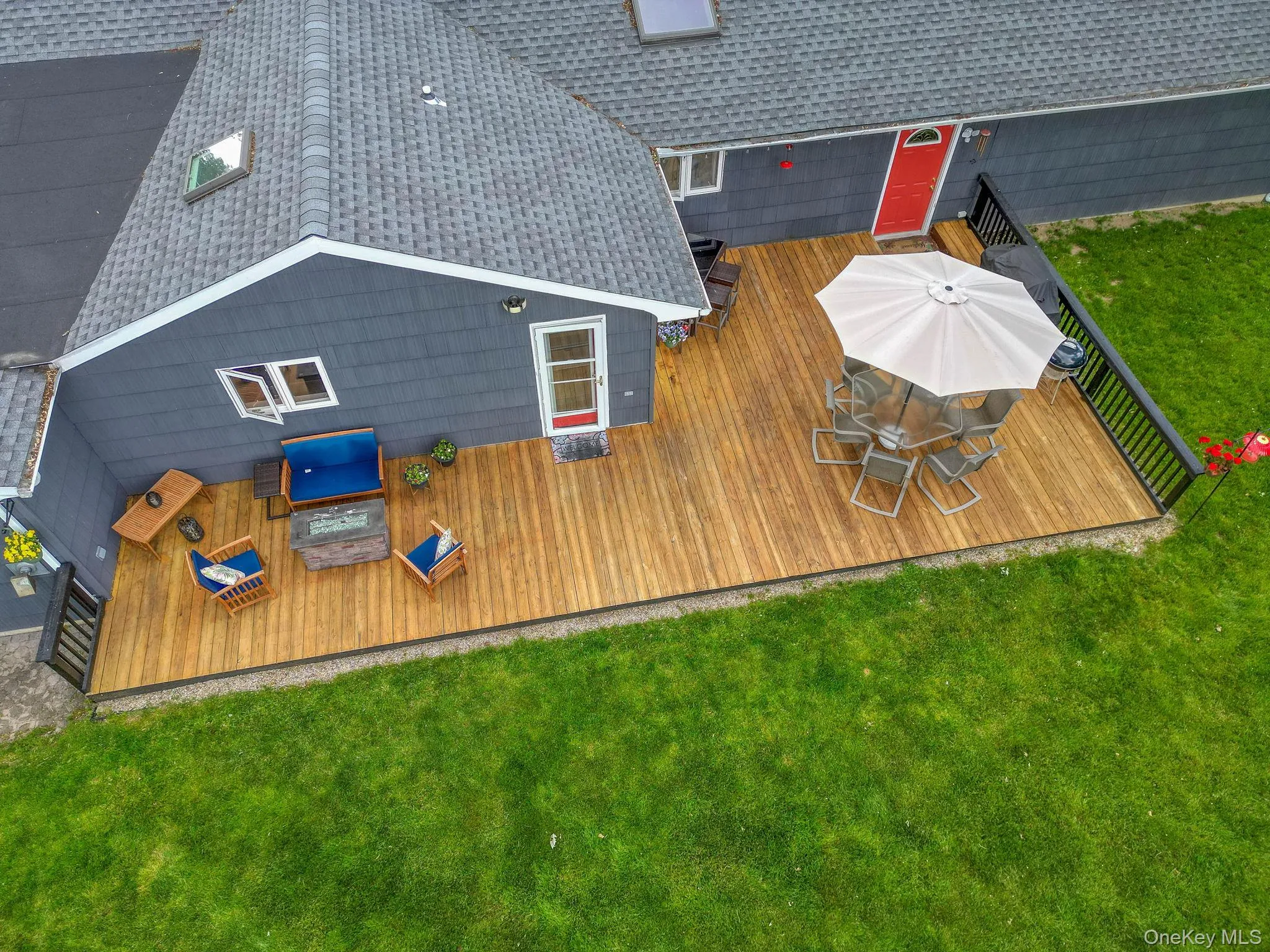Back of house with spacious deck Back of house with spacious deck