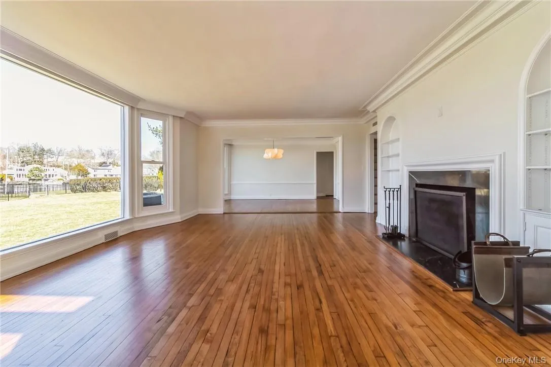Spacious living room with wood burning fireplace Spacious living room with wood burning fireplace