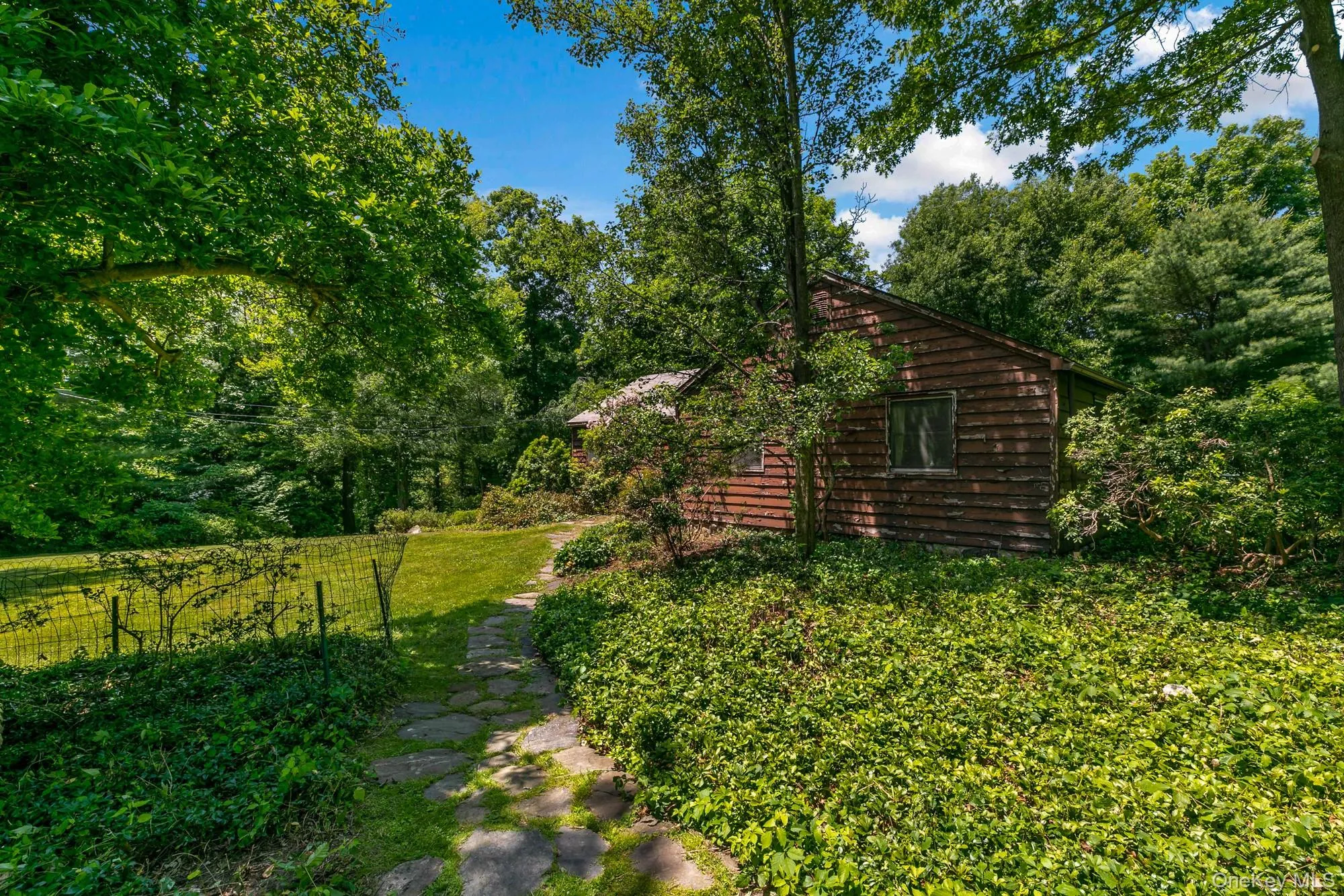 Whimsical stone path to front entrance. Whimsical stone path to front entrance.