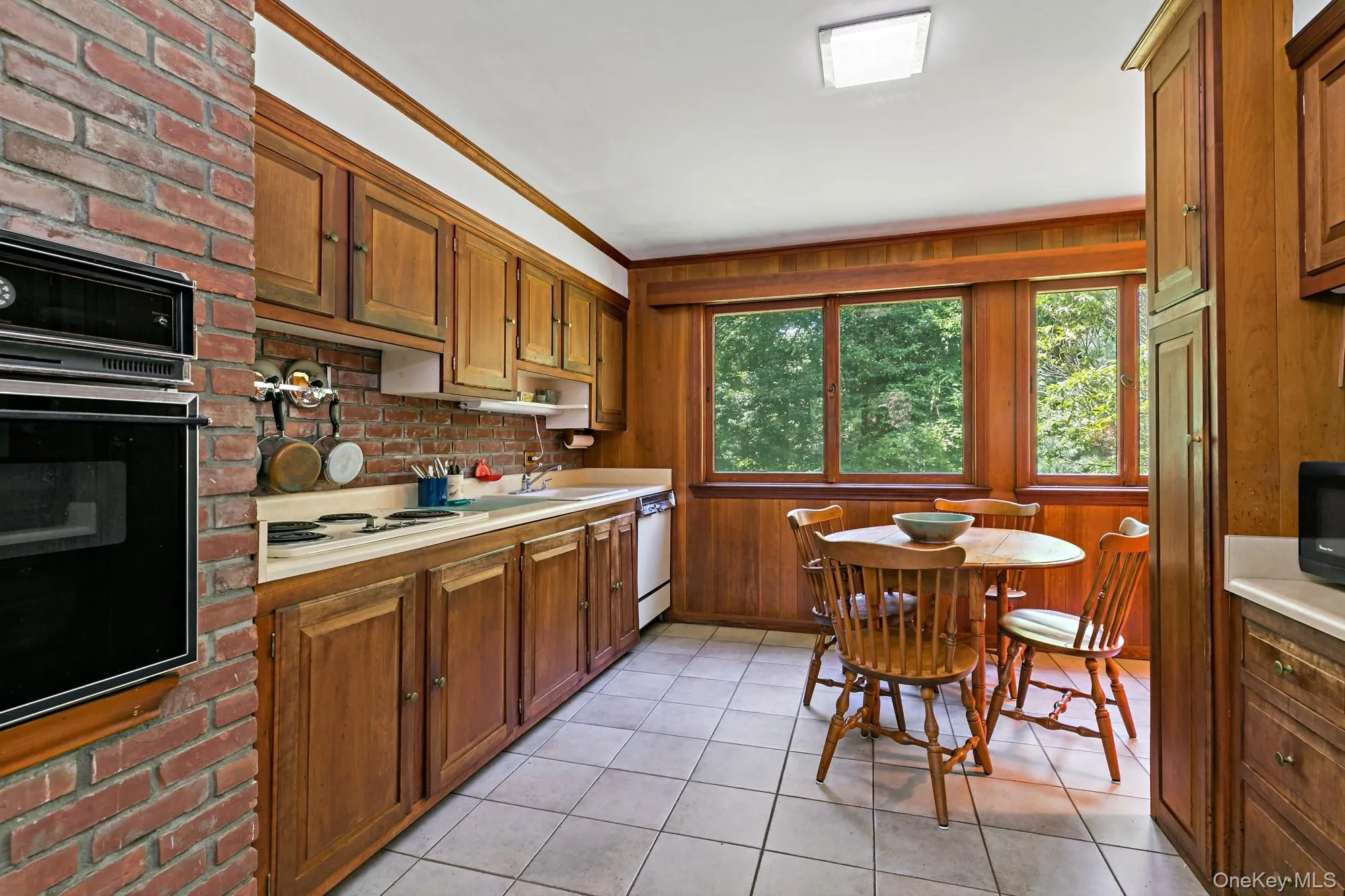 Working area of the eat in kitchen with gorgeous views to the backyard grounds. Working area of the eat in kitchen with gorgeous views to the backyard grounds.