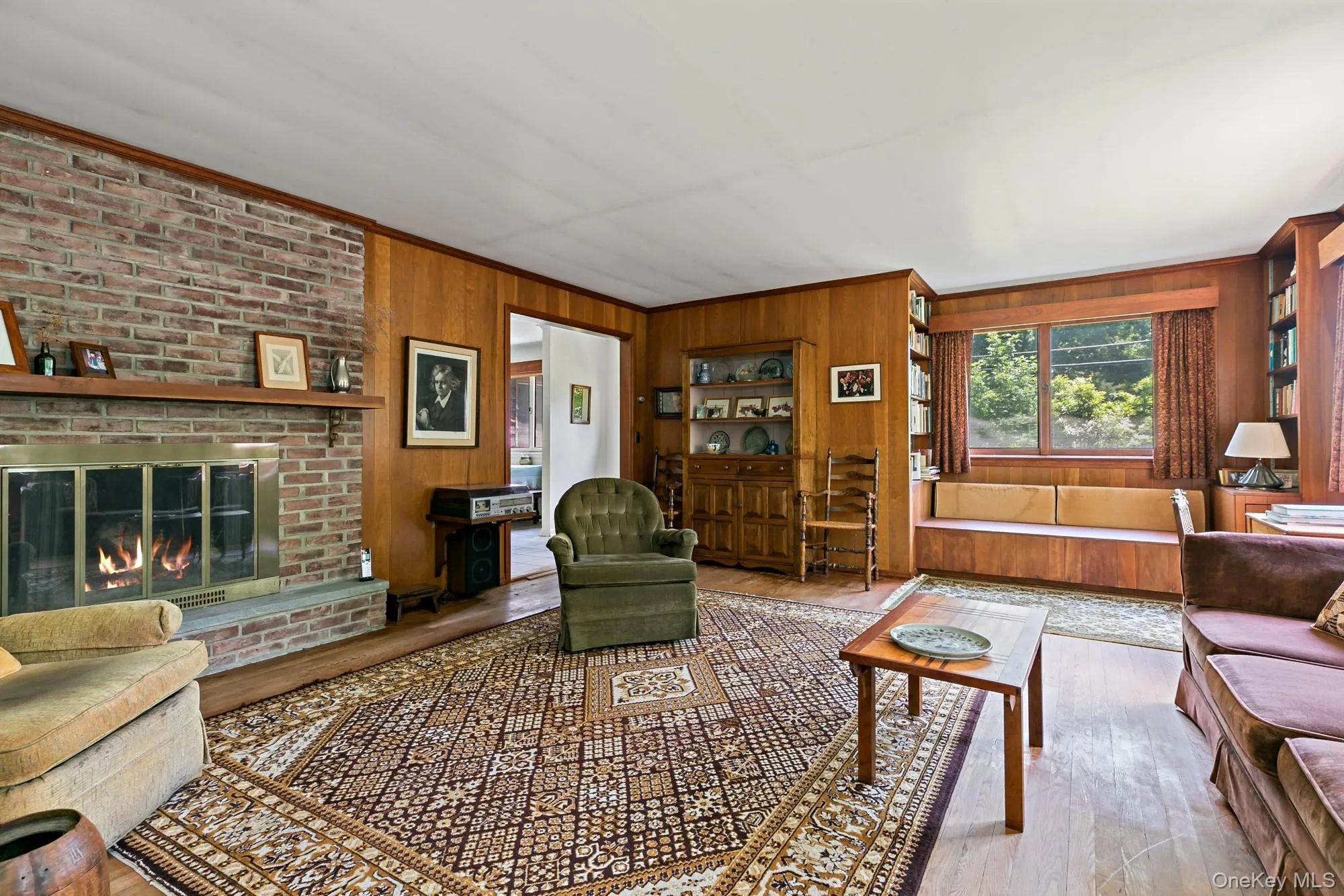 Massive brick fireplace with views of the custom cabinetry. Massive brick fireplace with views of the custom cabinetry.