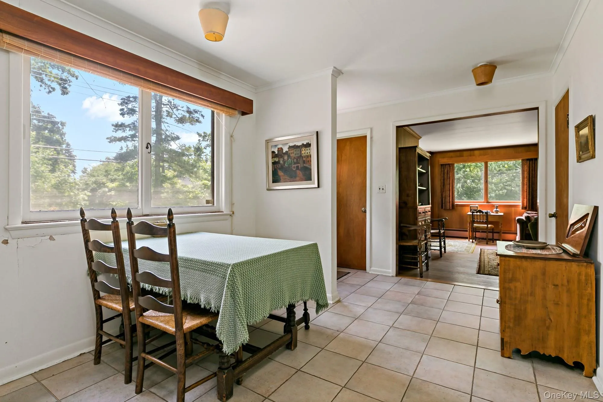 Photo showing formal dining looking through entrance way to living room. Photo showing formal dining looking through entrance way to living room.