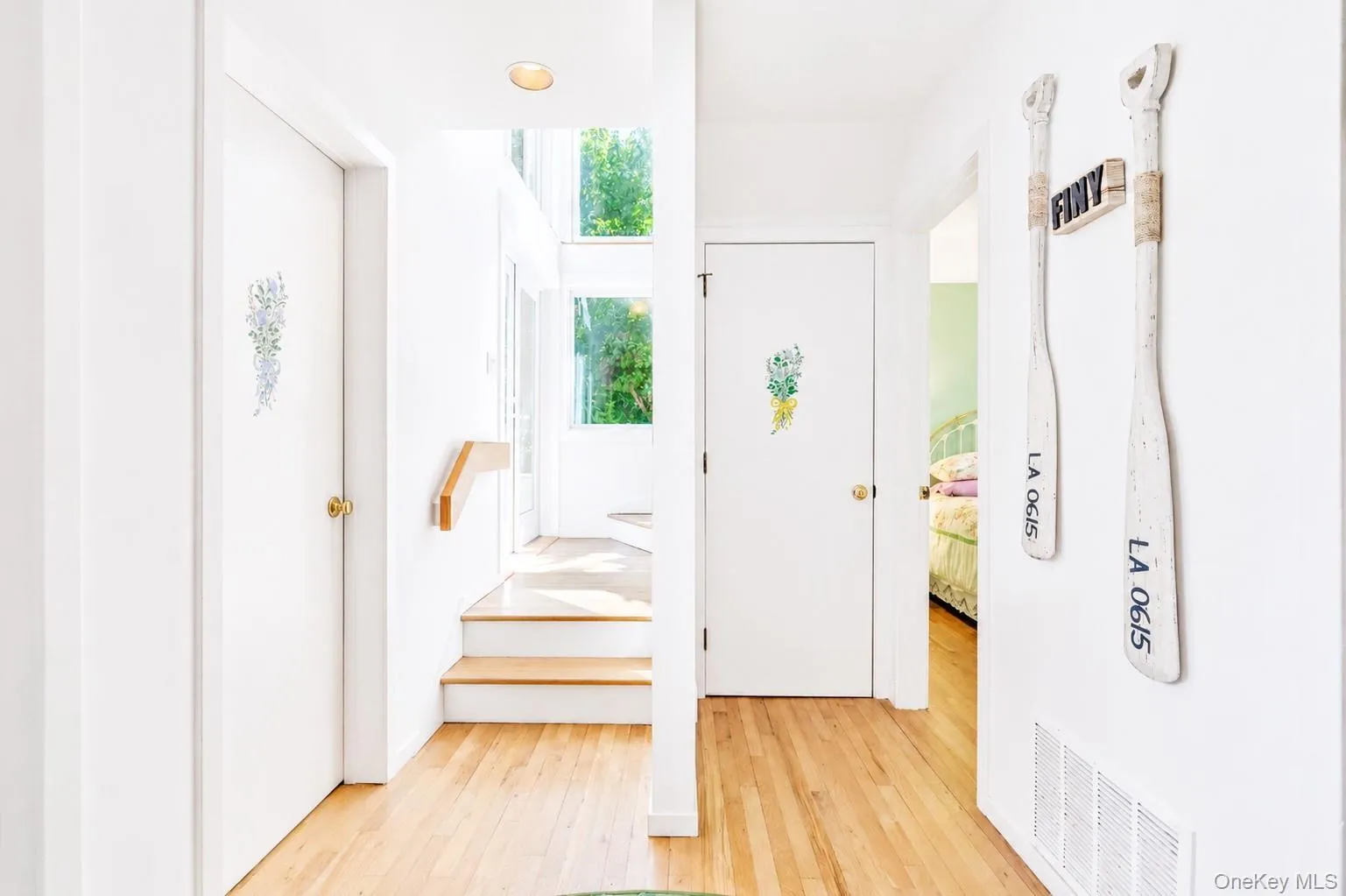 Stairs leading to upstairs, Laundry Room on left Stairs leading to upstairs, Laundry Room on left