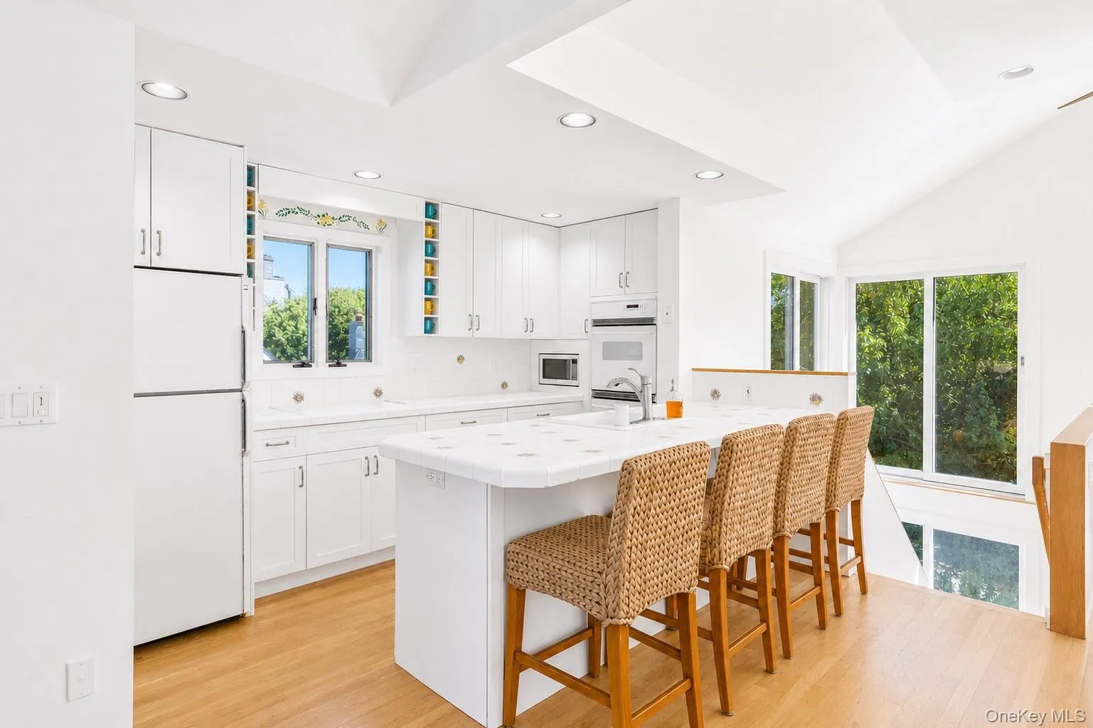 Eat in Kitchen with white cabinets and white appliances Eat in Kitchen with white cabinets and white appliances
