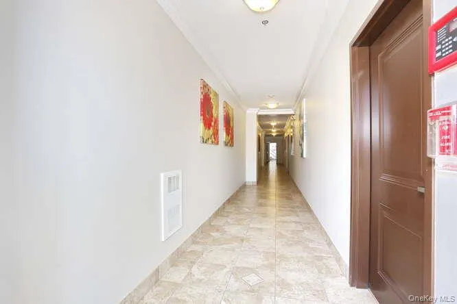 Corridor featuring ornamental molding Corridor featuring ornamental molding