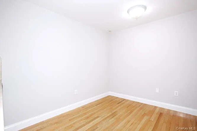 Empty room featuring baseboards and light wood-type flooring Empty room featuring baseboards and light wood-type flooring