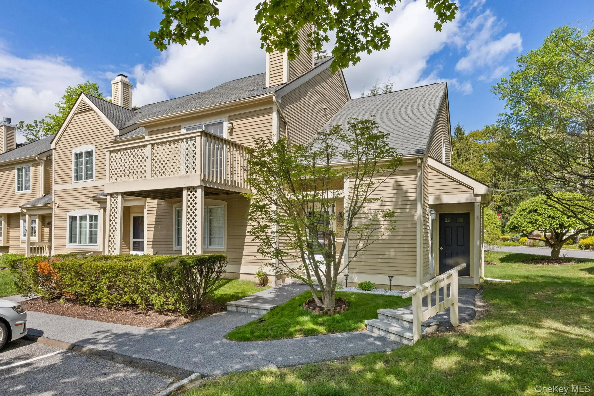 View of front of property with a chimney, a front yard, and a shingled roof View of front of property with a chimney, a front yard, and a shingled roof