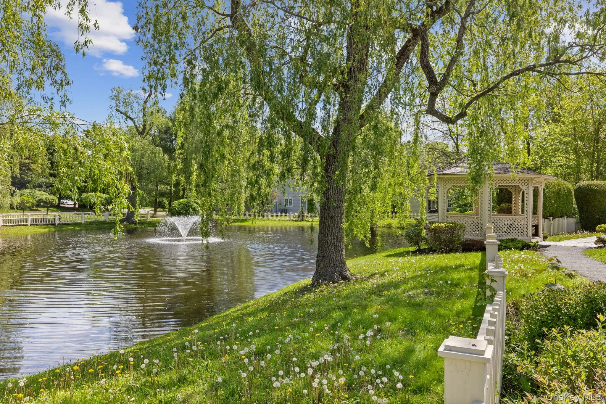 Water view with a gazebo and a tree filled landscape Water view with a gazebo and a tree filled landscape