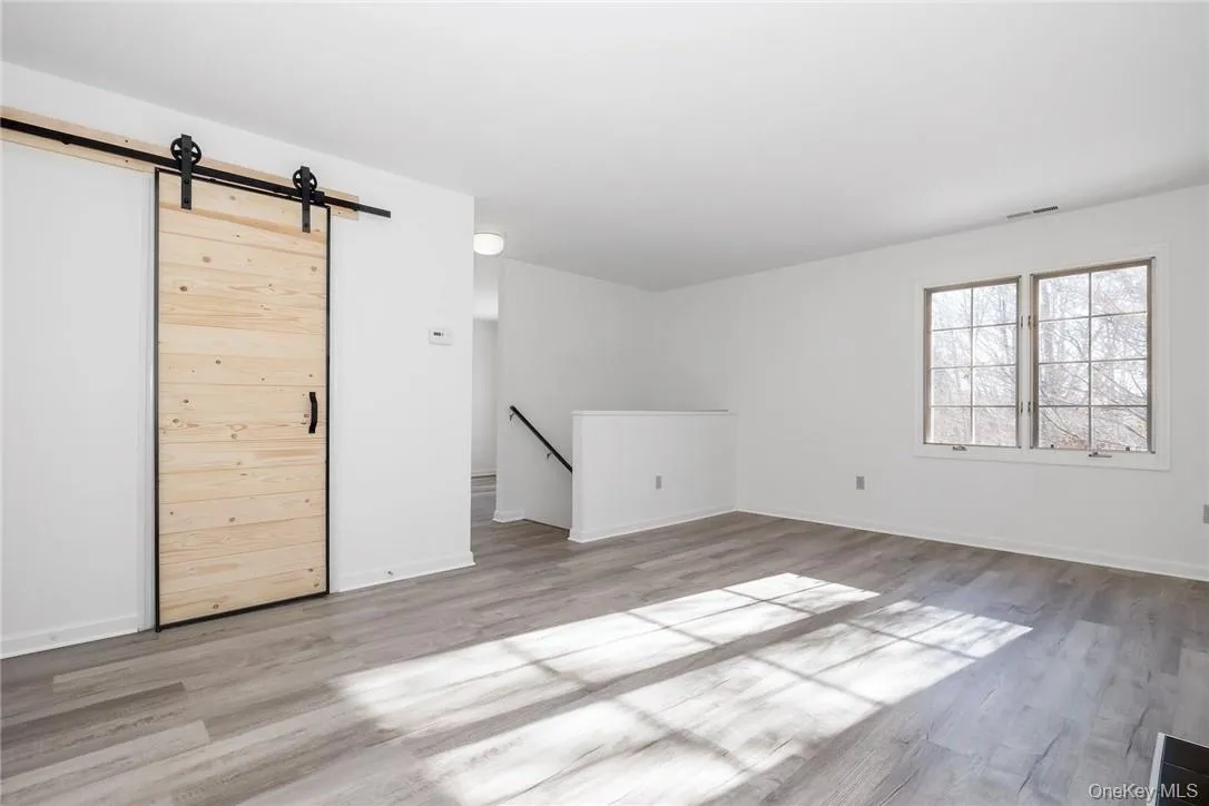Kitchen behind barn door. Stairs up brought you to main level. Kitchen behind barn door. Stairs up brought you to main level.