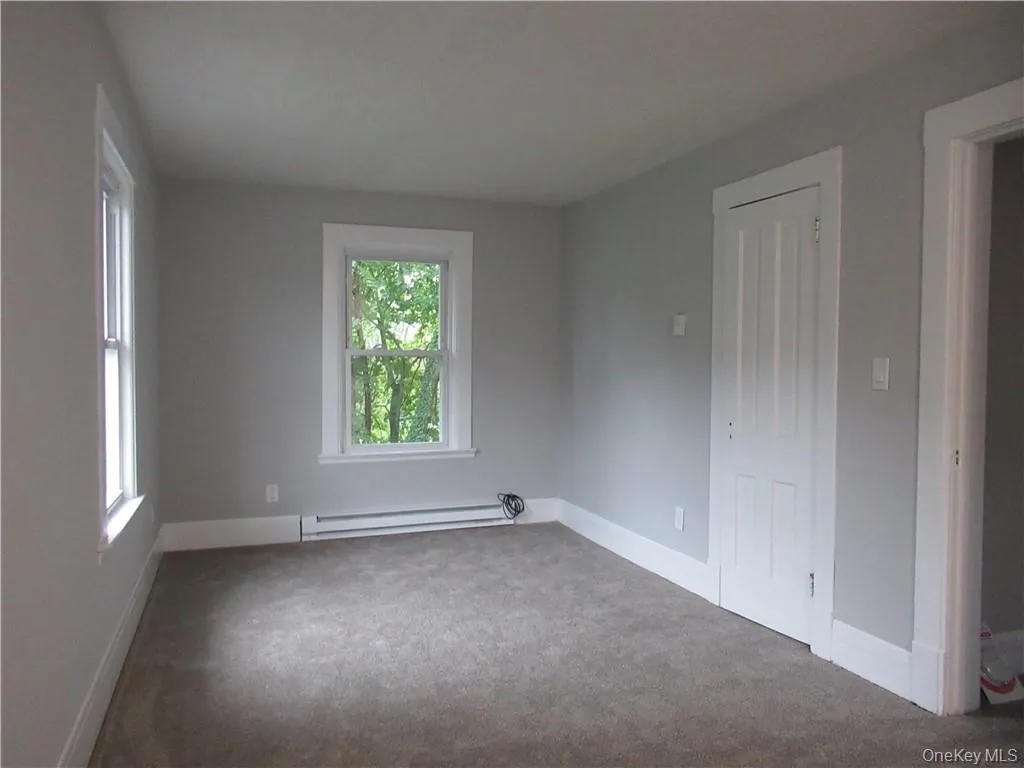 Carpeted open concept space Carpeted open concept space