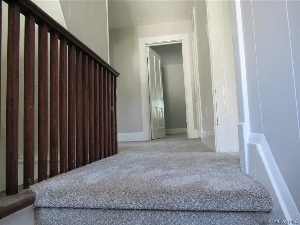 Carpeted stairway to second floor Carpeted stairway to second floor
