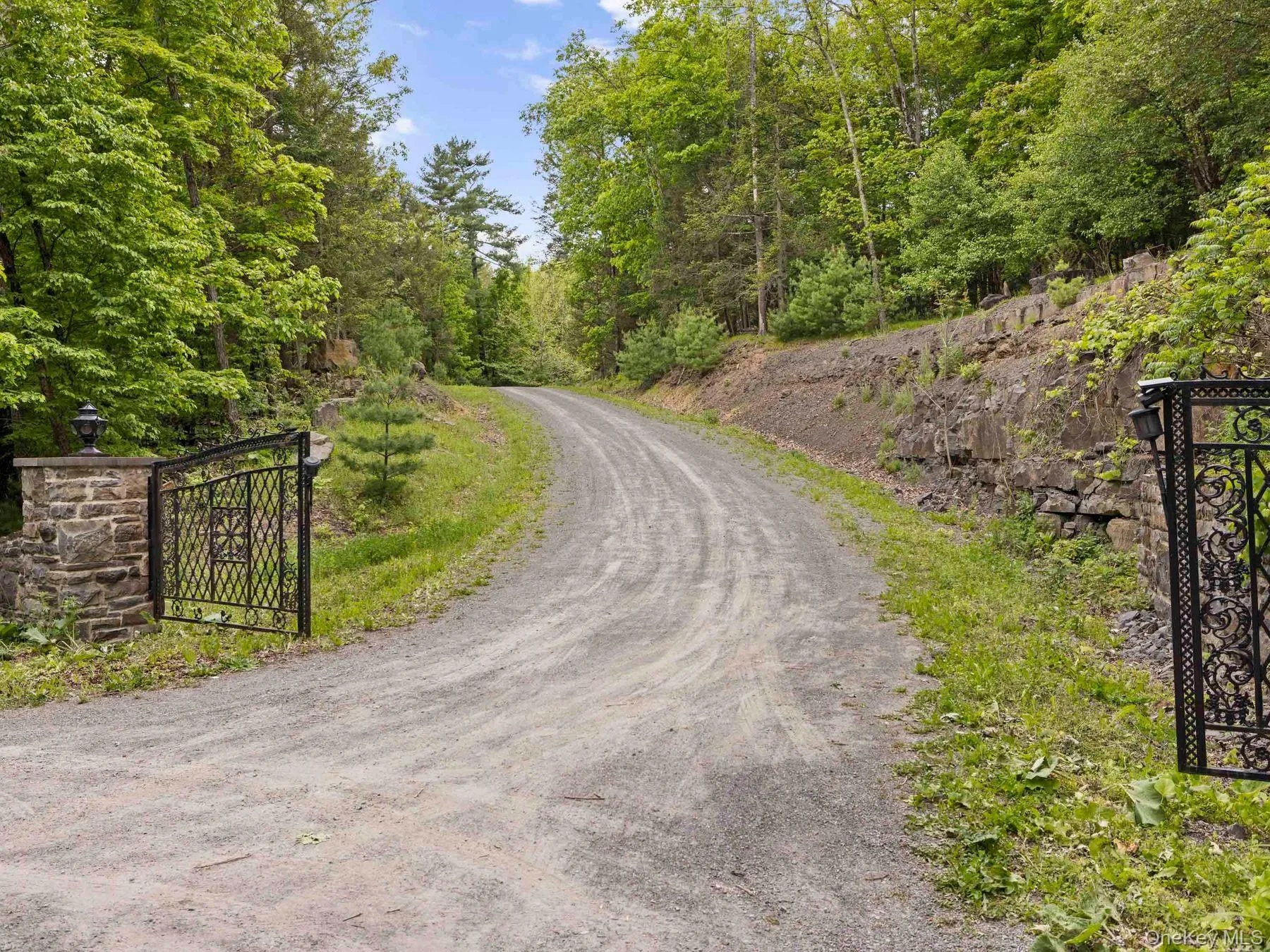 Stone pillars and wrought iron gates Stone pillars and wrought iron gates