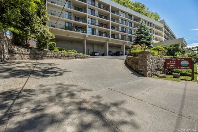 Multi-story condominium building featuring numerous private balconies Multi-story condominium building featuring numerous private balconies