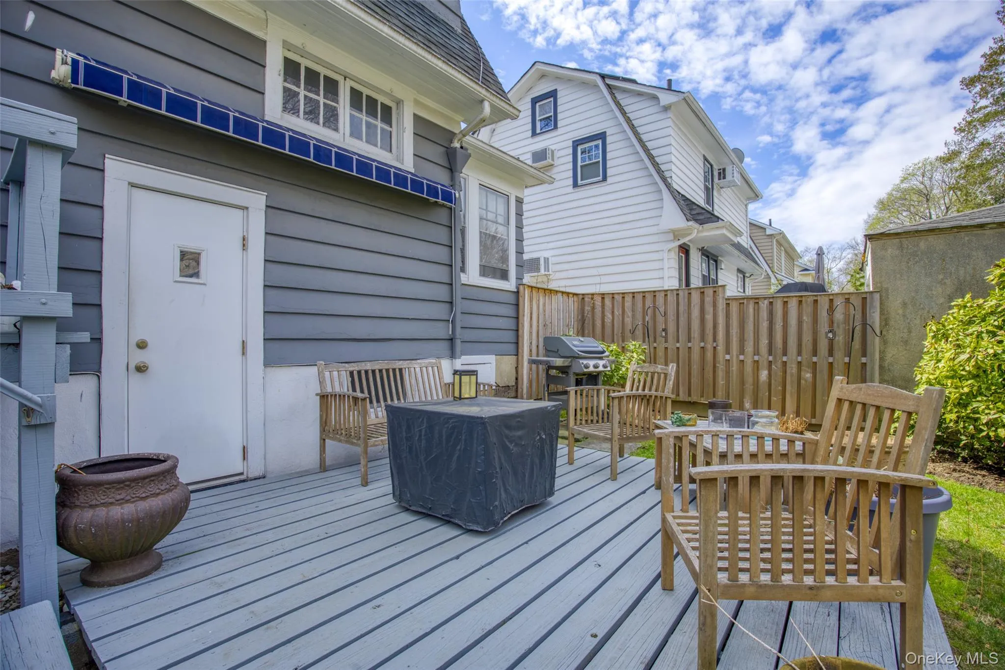 Expansive outdoor deck with slatted wood flooring Expansive outdoor deck with slatted wood flooring