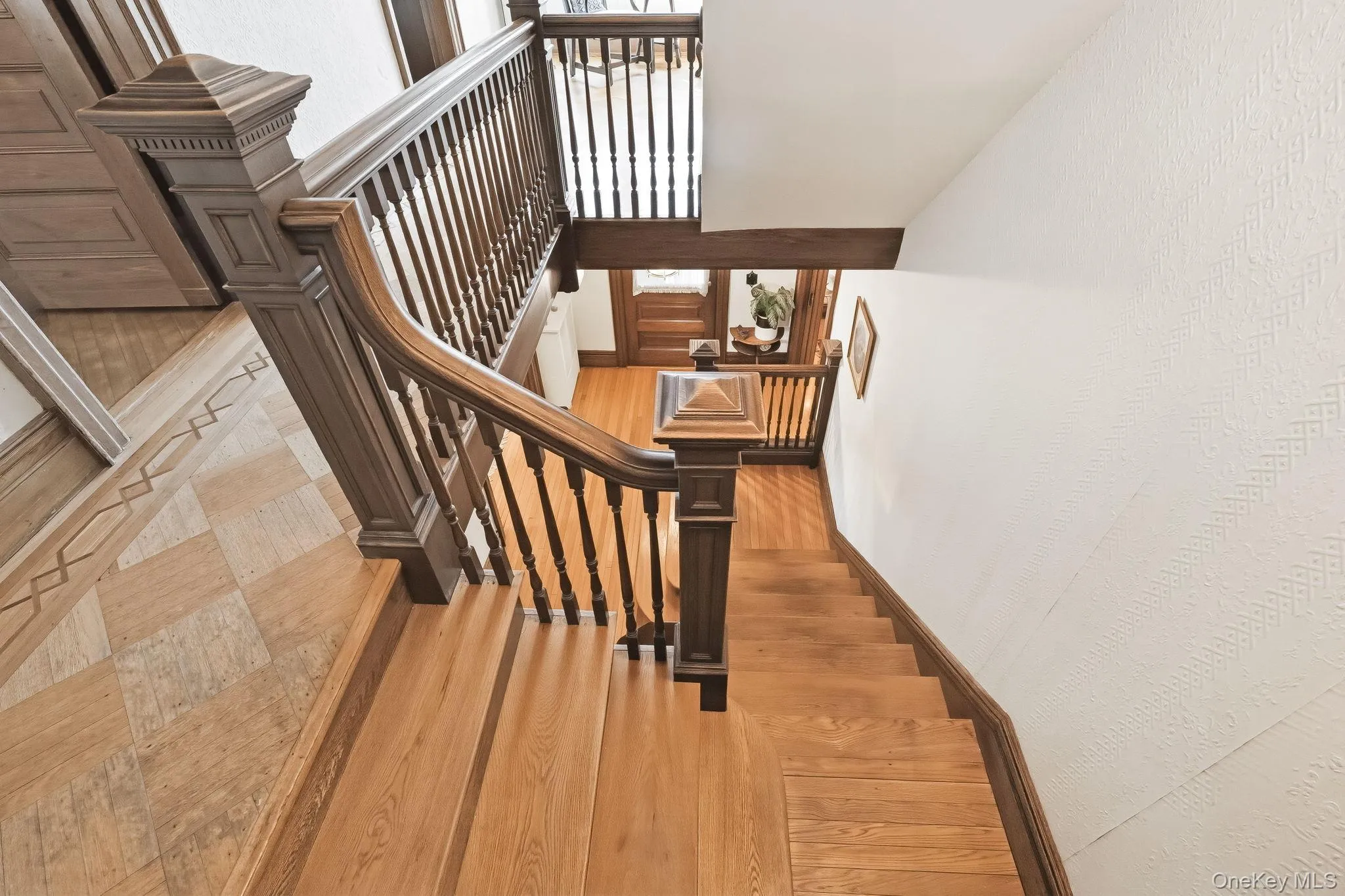 A charming upper-level sitting area with views below. A charming upper-level sitting area with views below.