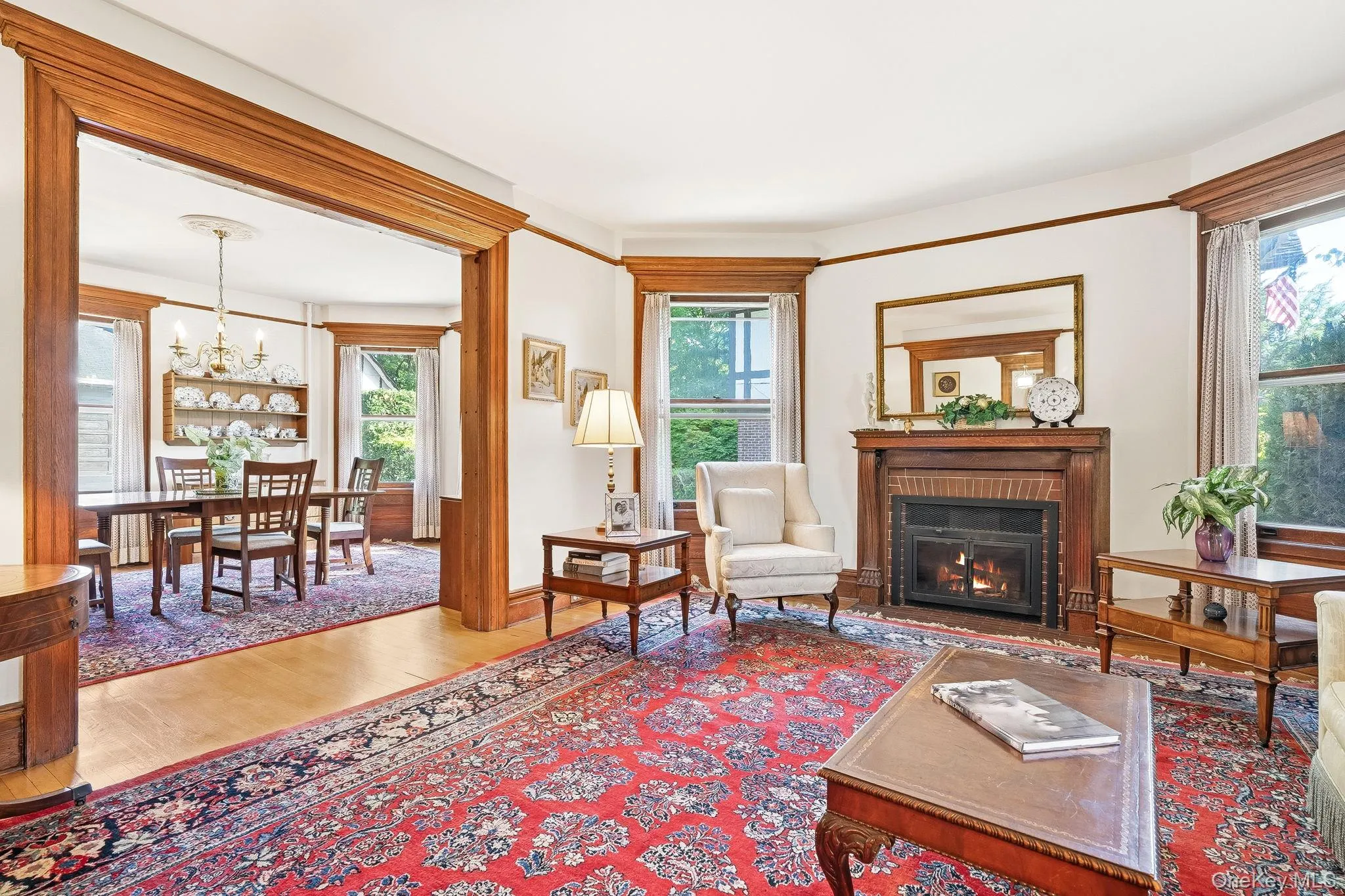 Grand formal living room anchored by a classic wood-burning fireplace. Grand formal living room anchored by a classic wood-burning fireplace.