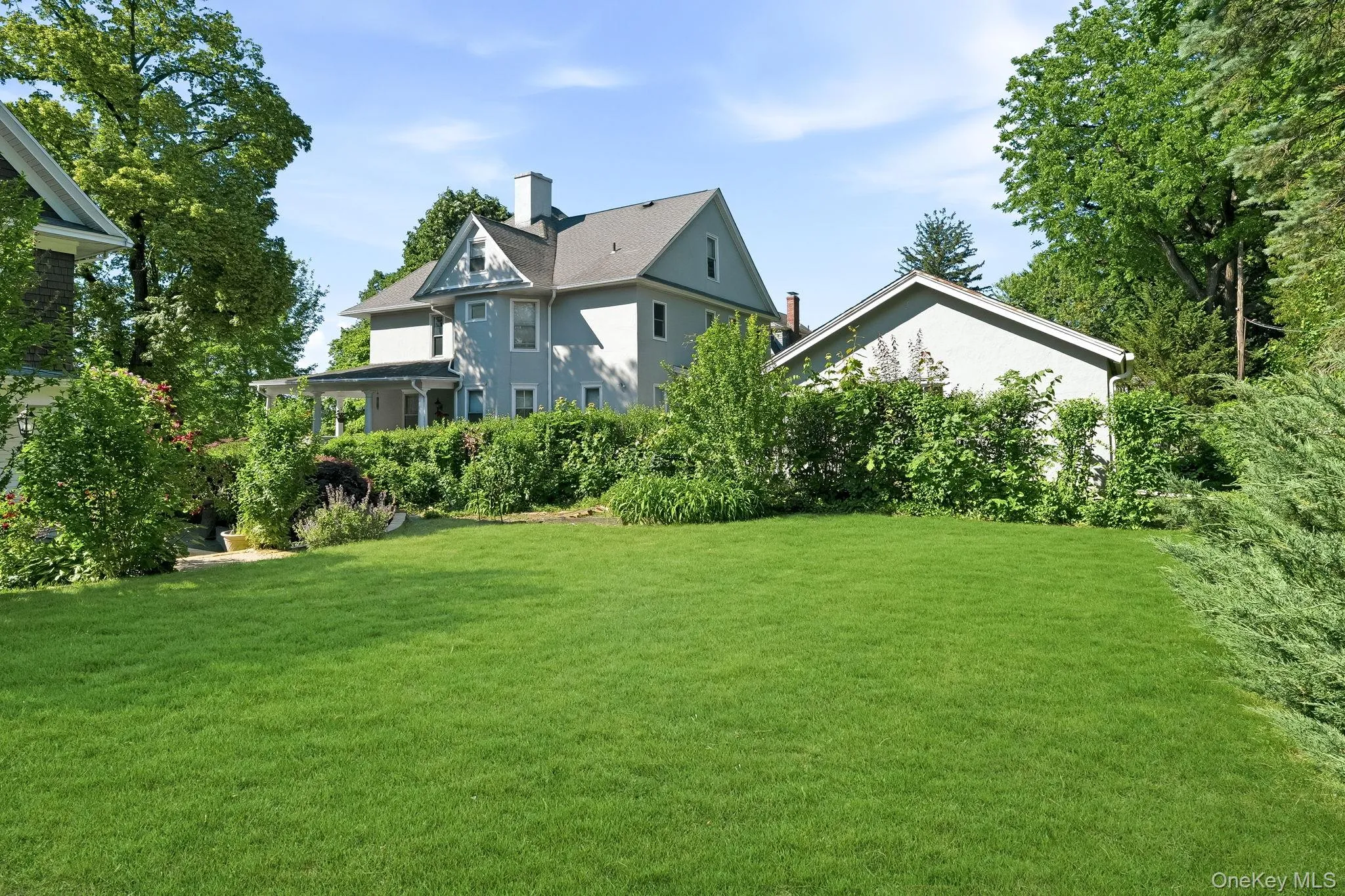 A tranquil backyard oasis framed by mature landscaping. A tranquil backyard oasis framed by mature landscaping.