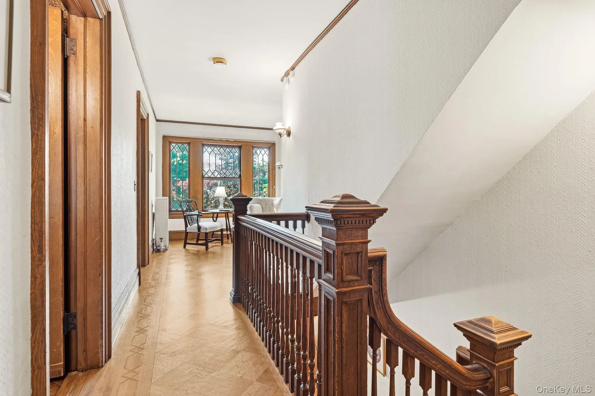 An inviting sitting area overlooking the home's stunning architectural details. An inviting sitting area overlooking the home's stunning architectural details.