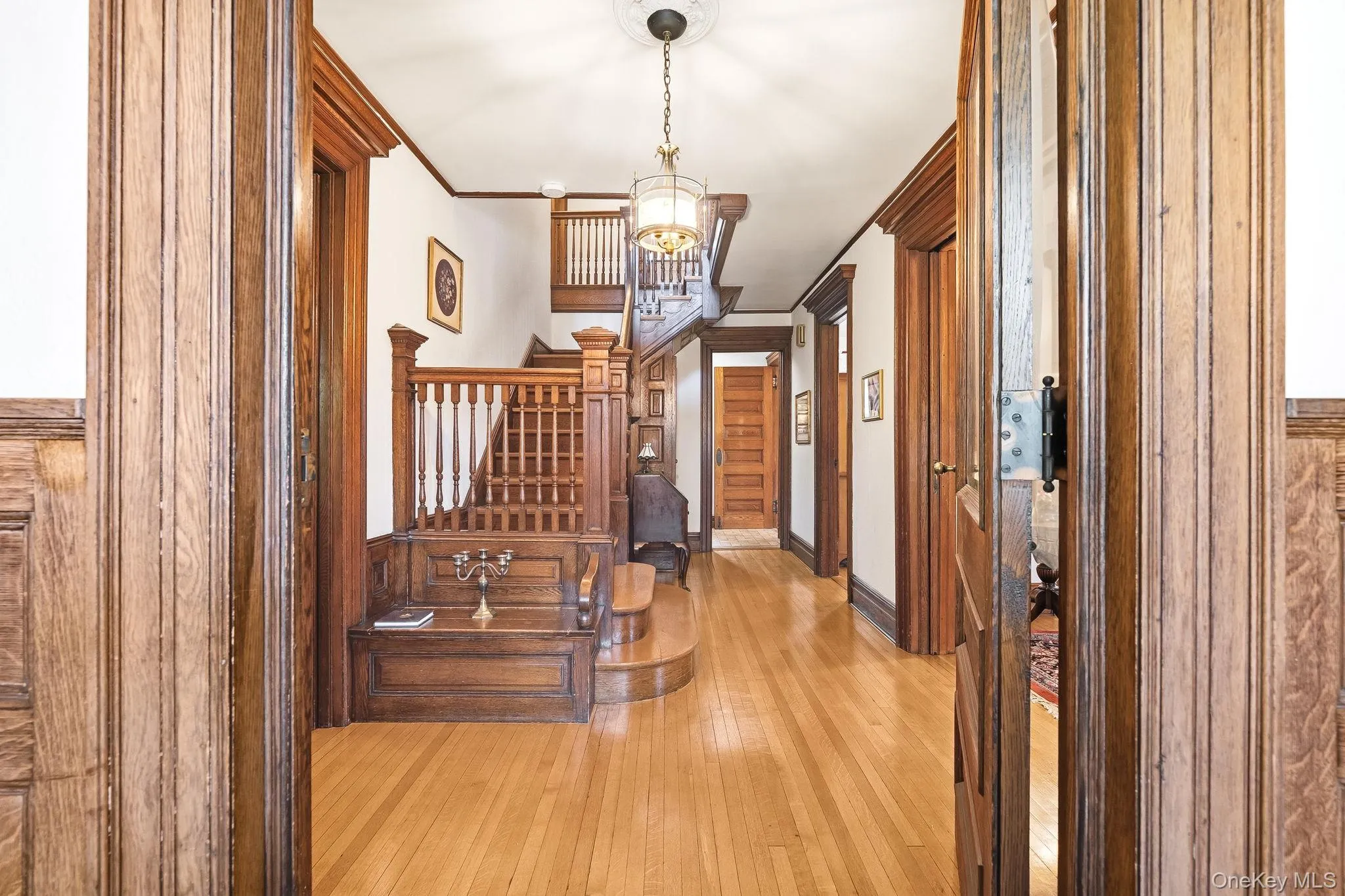 Highlighted by a stately grand wooden staircase, a stunningcenterpiece that sets the tone for the remarkable artistry found throughout Highlighted by a stately grand wooden staircase, a stunningcenterpiece that sets the tone for the remarkable artistry found throughout