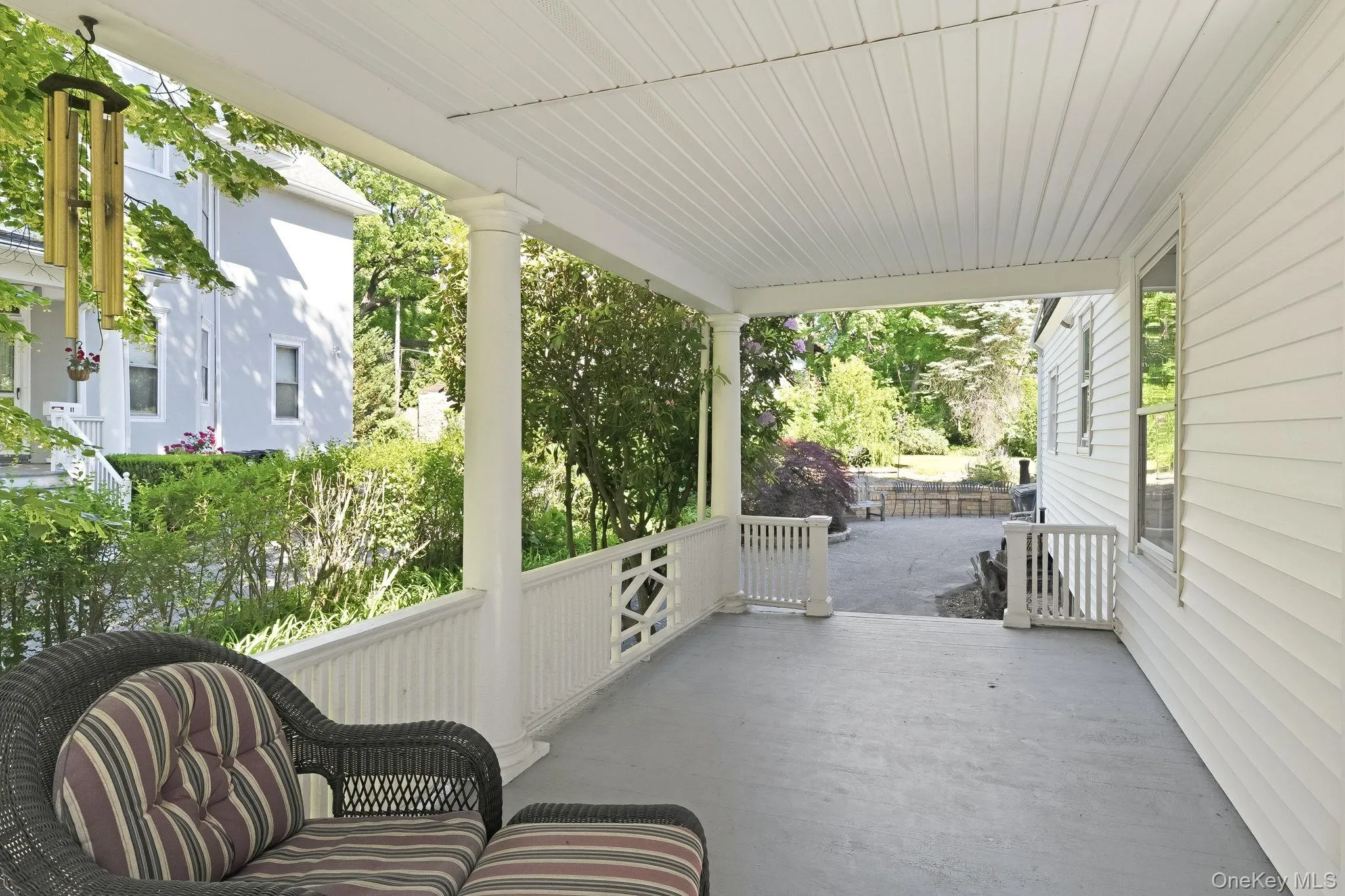 Endless moments await on this gracious wraparound porch. Endless moments await on this gracious wraparound porch.