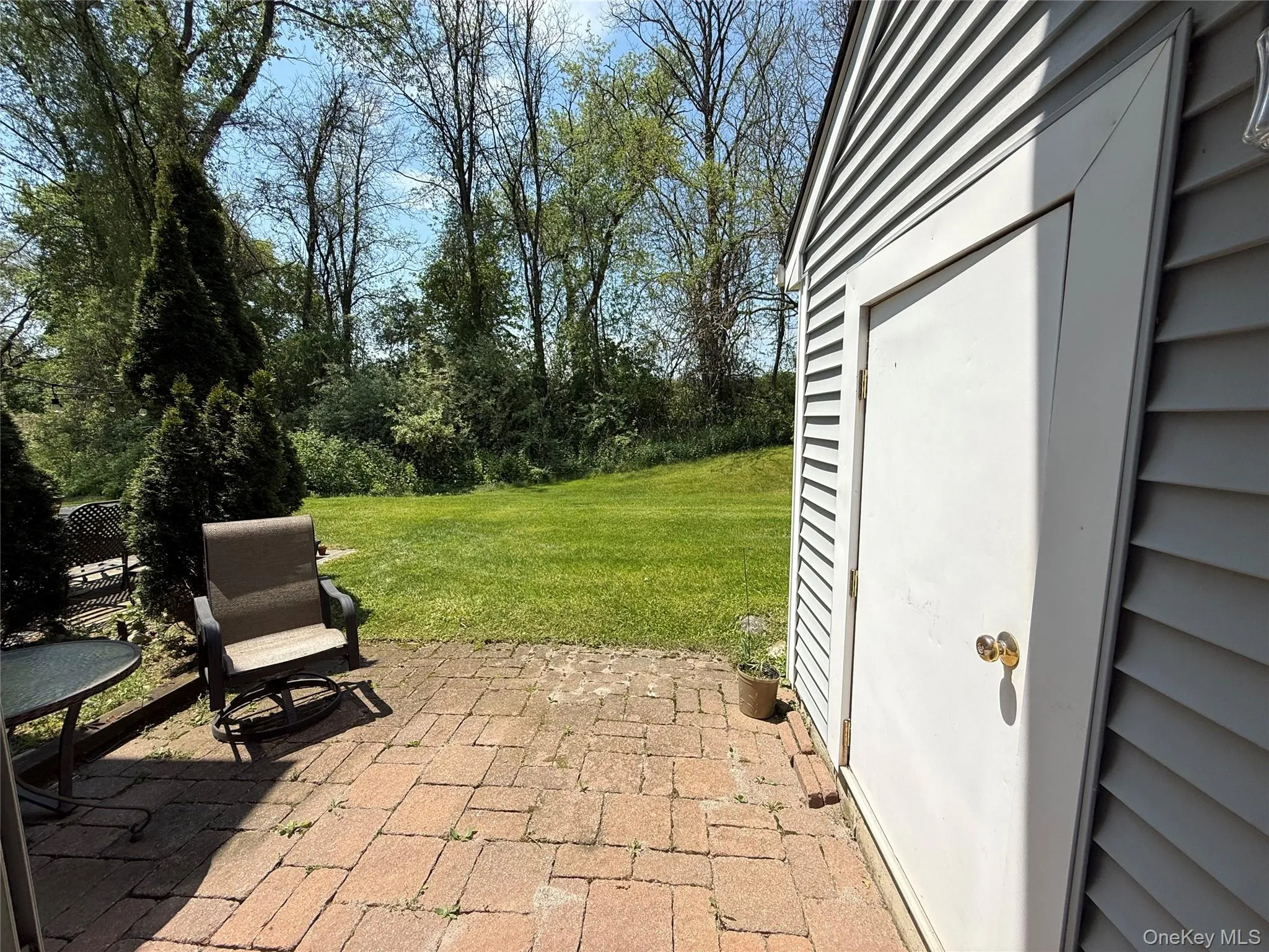 Located off the living room is a brick patio and a storage shed. Located off the living room is a brick patio and a storage shed.