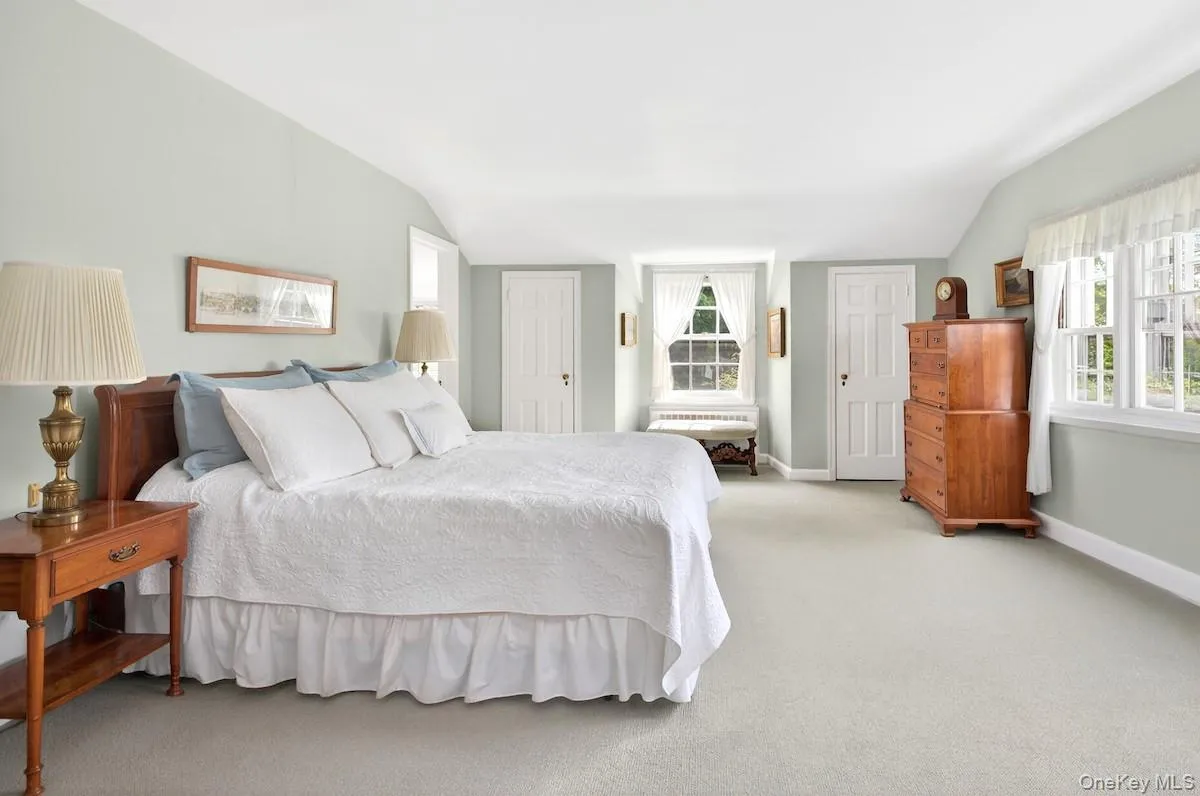 Primary bedroom suite with year-round river views Primary bedroom suite with year-round river views