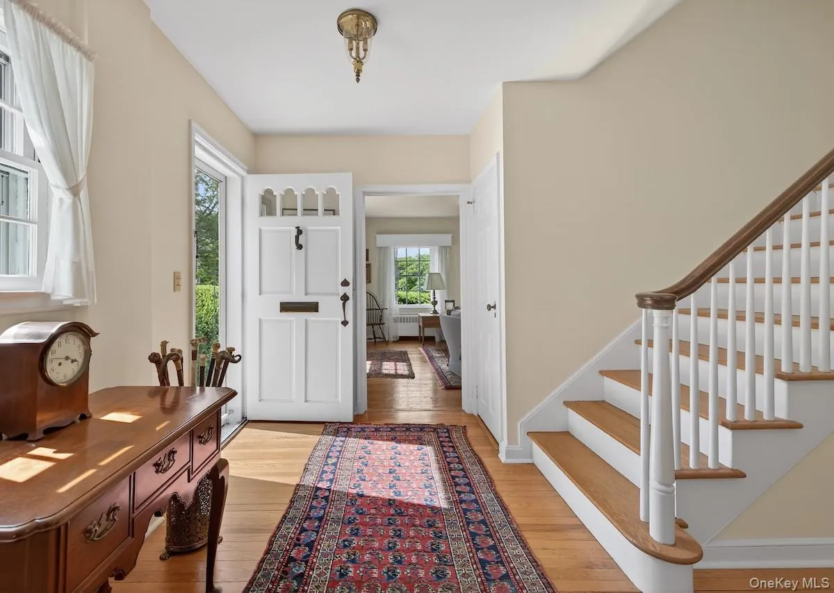 Gracious entrance foyer with classic Colonial staircase Gracious entrance foyer with classic Colonial staircase